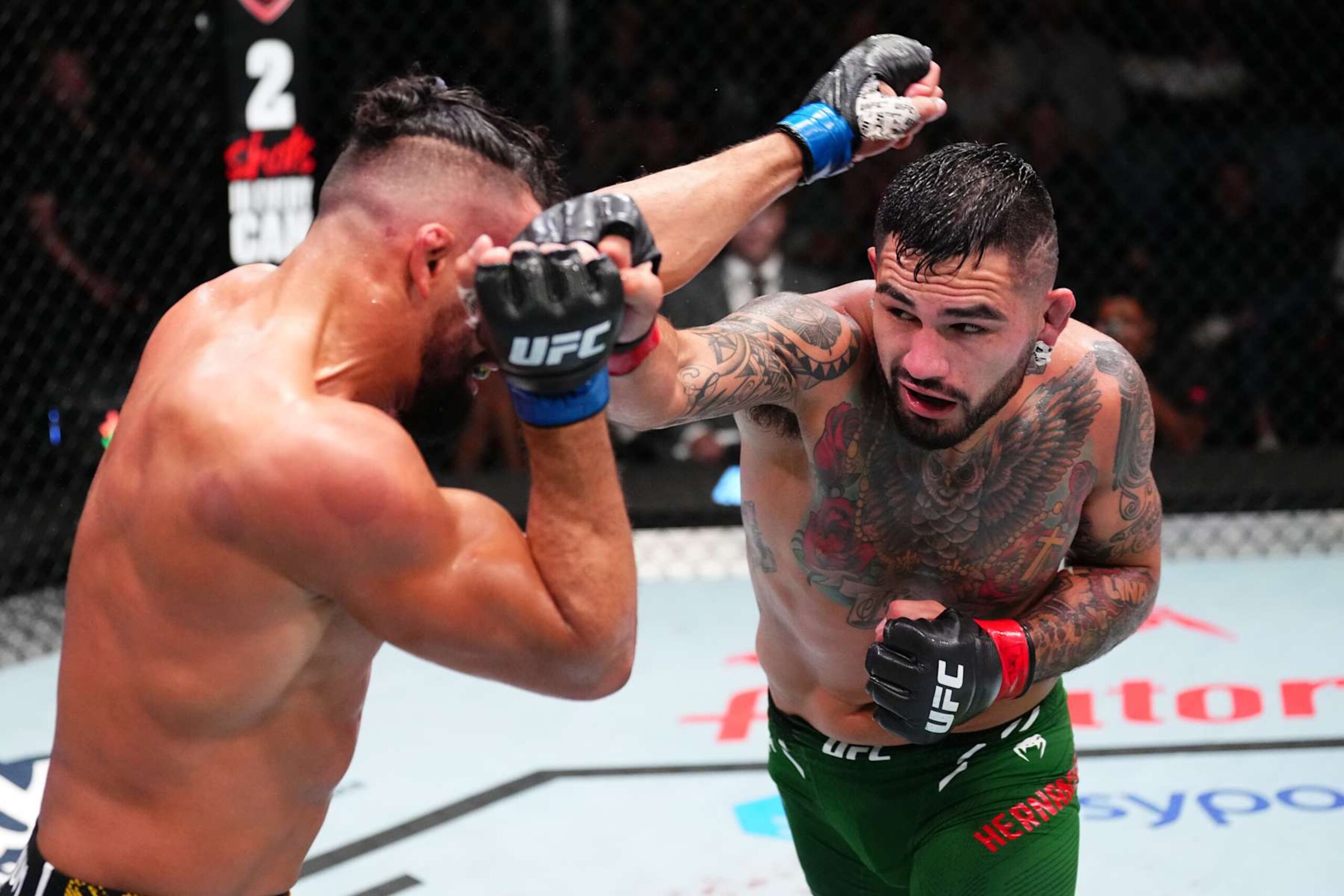 LAS VEGAS, NEVADA - OCTOBER 19: (R-L) Anthony Hernandez punches Michel Pereira of Brazil in a middleweight fight during the UFC Fight Night event at UFC APEX on October 19, 2024 in Las Vegas, Nevada.  (Photo by Jeff Bottari/Zuffa LLC)