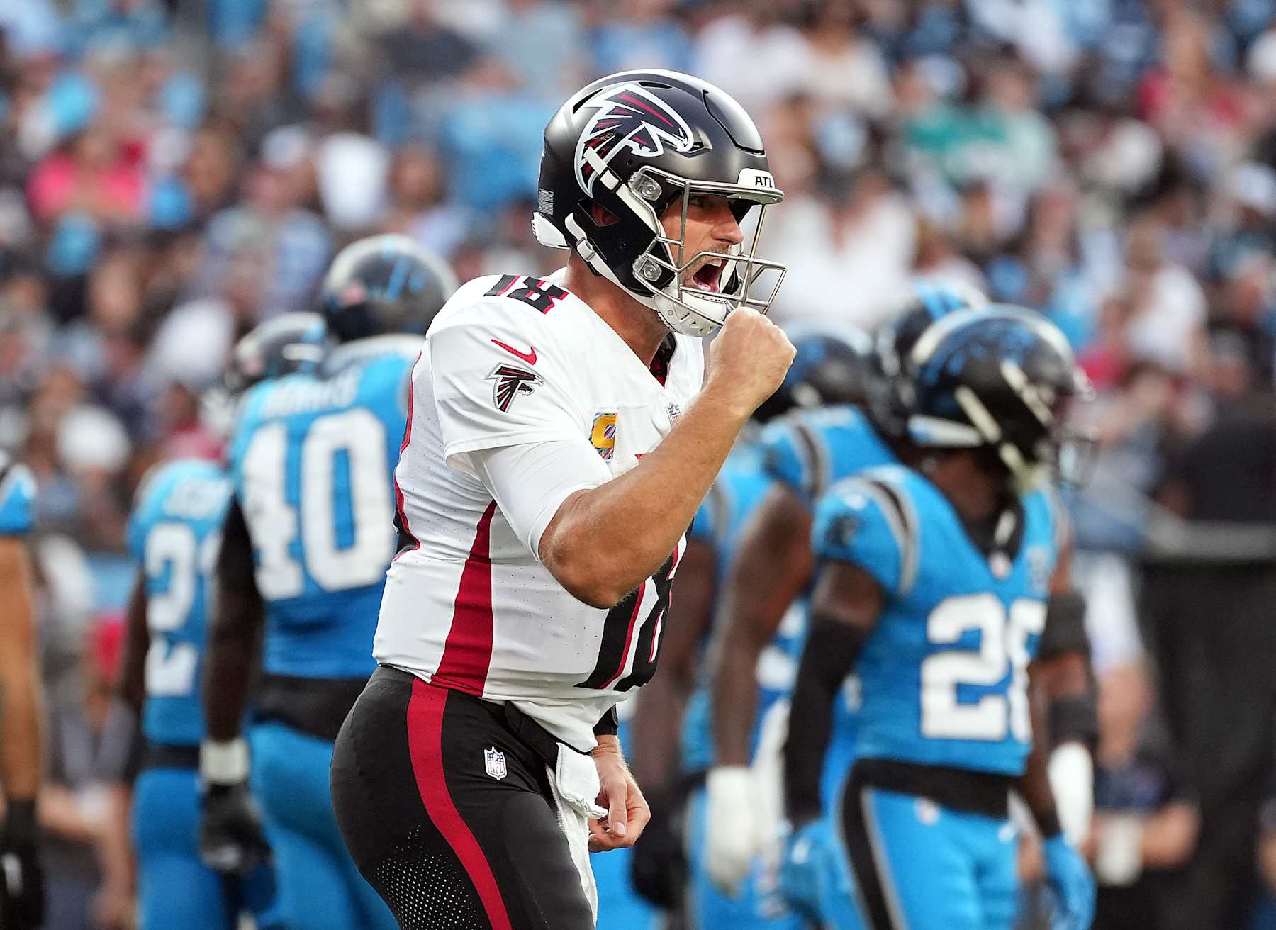 CHARLOTTE, NORTH CAROLINA - OCTOBER 13: Kirk Cousins #18 of the Atlanta Falcons reacts after throwing for a touchdown as they play the Carolina Panthers in the second quarter at Bank of America Stadium on October 13, 2024 in Charlotte, North Carolina. (Photo by Grant Halverson/Getty Images)