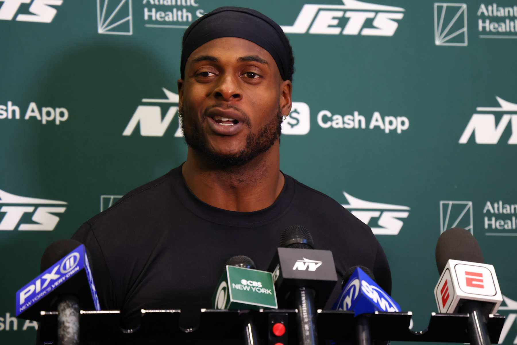 EAST RUTHERFORD, NEW JERSEY - OCTOBER 16: Davante Adams #17 of the New York Jets speaks to members of the media at the Atlantic Health Jets Training Center on October 16, 2024 in Florham Park, New Jersey. (Photo by Ed Mulholland/Getty Images)