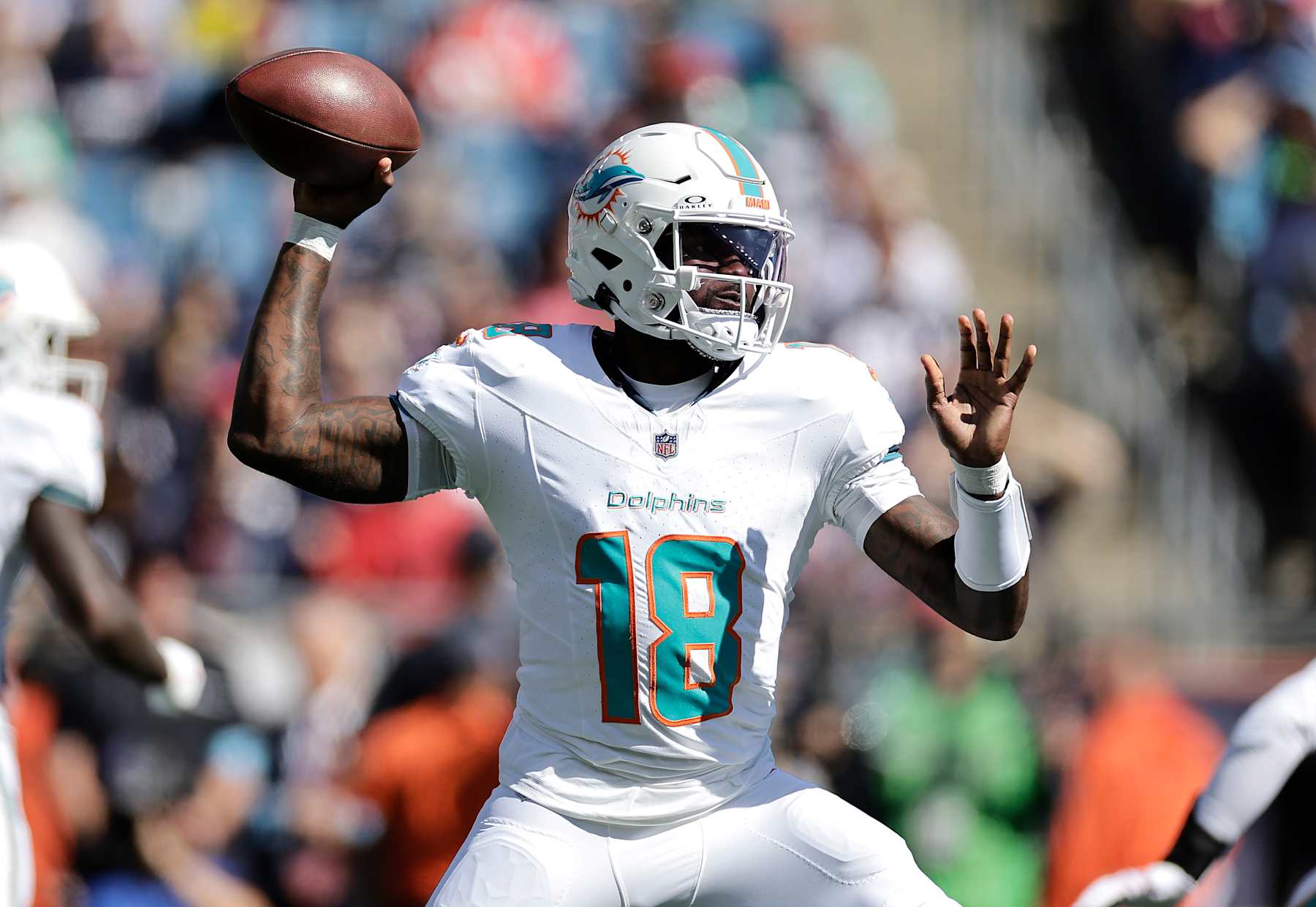 FOXBOROUGH, MASSACHUSETTS - OCTOBER 06: Tyler Huntley #18 of the Miami Dolphins throws a pass during the first quarter against the New England Patriots at Gillette Stadium on October 06, 2024 in Foxborough, Massachusetts. (Photo by Adam Hunger/Getty Images)