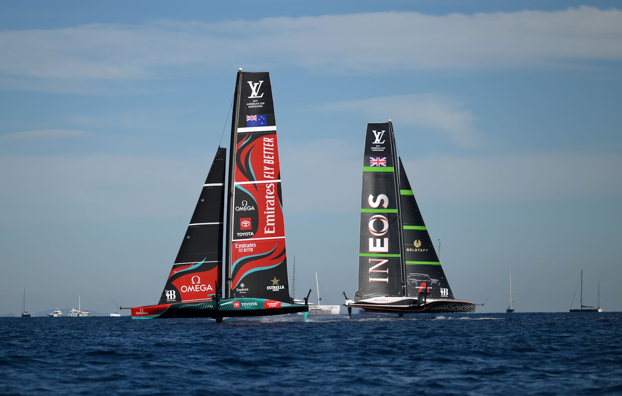 BARCELONA, SPAIN - OCTOBER 19: Crews of Emirates Team New Zealand and Team Ineos Britannia compete during the race between Emirates Team New Zealand and Team Ineos Britannia in the 37th America's Cup on October 19, 2024 in Barcelona, Spain. (Photo by David Ramos/Getty Images)