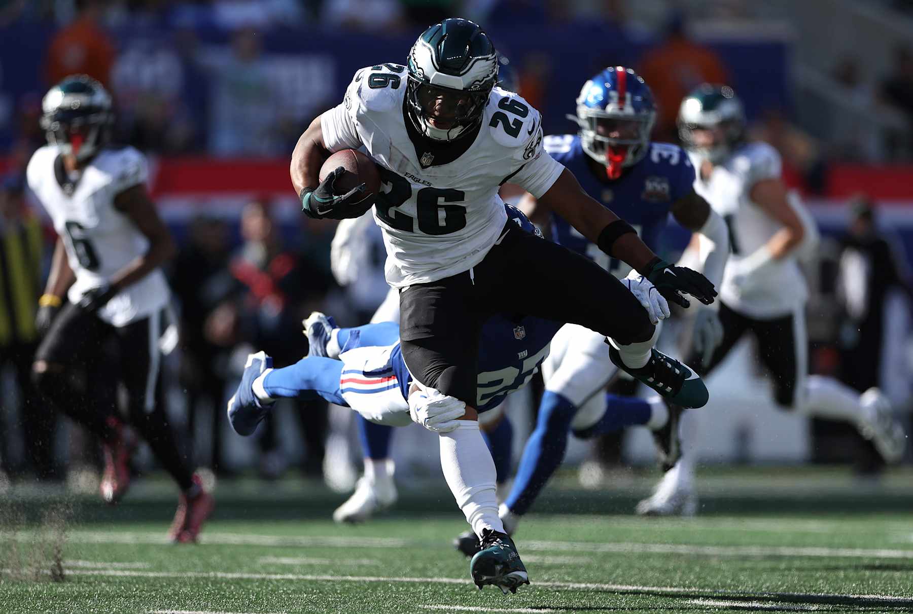 EAST RUTHERFORD, NEW JERSEY - OCTOBER 20: Saquon Barkley #26 of the Philadelphia Eagles runs the ball against the New York Giants during the third quarter at MetLife Stadium on October 20, 2024 in East Rutherford, New Jersey. (Photo by Luke Hales/Getty Images)
