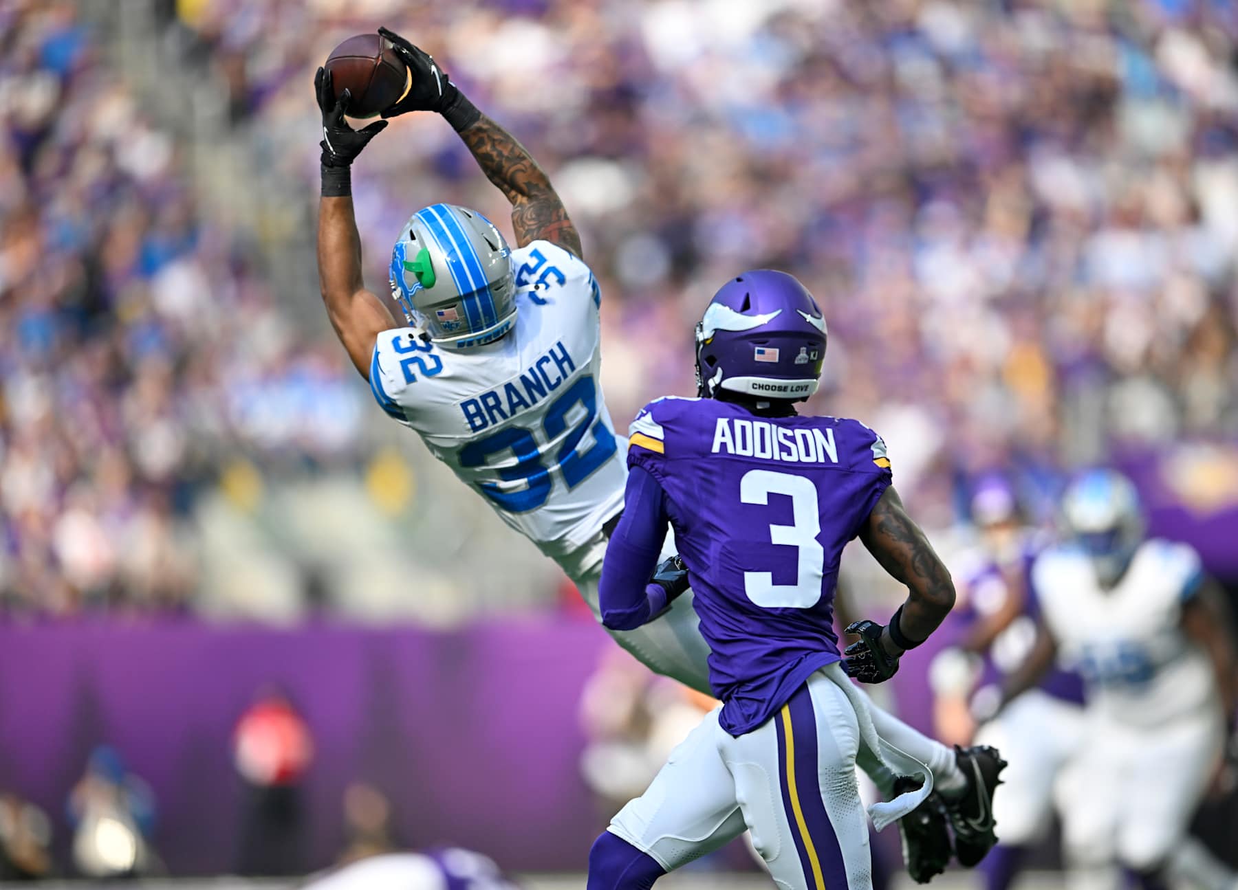 MINNEAPOLIS, MINNESOTA - OCTOBER 20: Brian Branch #32 of the Detroit Lions intercepts a pass intended for Jordan Addison #3 of the Minnesota Vikings in the second quarter of a game at U.S. Bank Stadium on October 20, 2024 in Minneapolis, Minnesota. (Photo by Stephen Maturen/Getty Images)