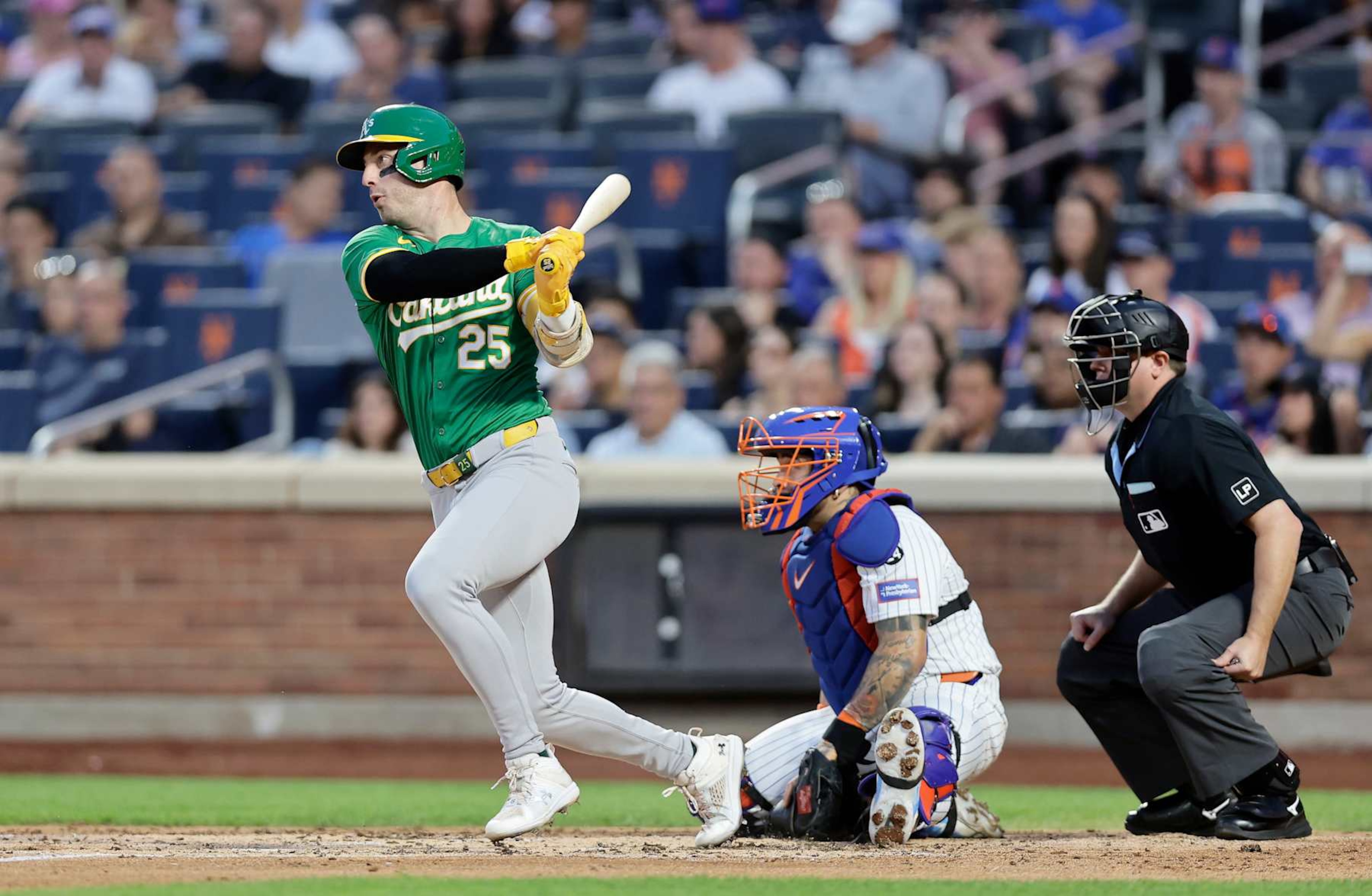 NEW YORK, NEW YORK - AUGUST 13:  Brent Rooker #25 of the Oakland Athletics follows through on his third inning single against the New York Mets at Citi Field on August 13, 2024 in New York City. The Athletics defeated the Mets 9-4. (Photo by Jim McIsaac/Getty Images)