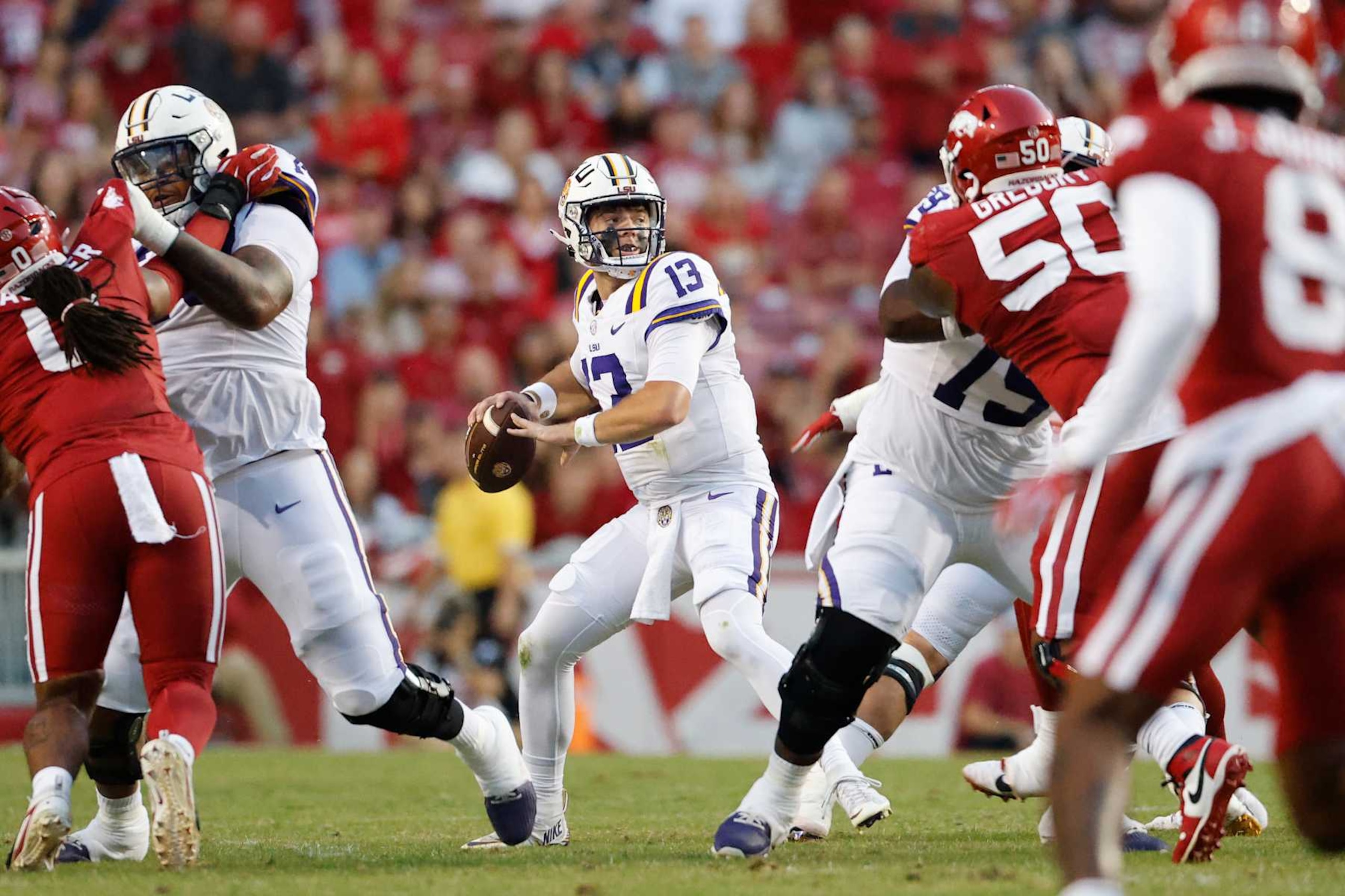 FAYETTEVILLE, AR - OCTOBER 19:  LSU Tigers quarterback Garrett Nussmeier (13) with a pass attempt during the college football game between the LSU Tigers and Arkansas Razorbacks on October 19, 2024, at Donald W. Reynolds Razorback Stadium in Fayetteville, Arkansas. (Photo by Andy Altenburger/Icon Sportswire via Getty Images)