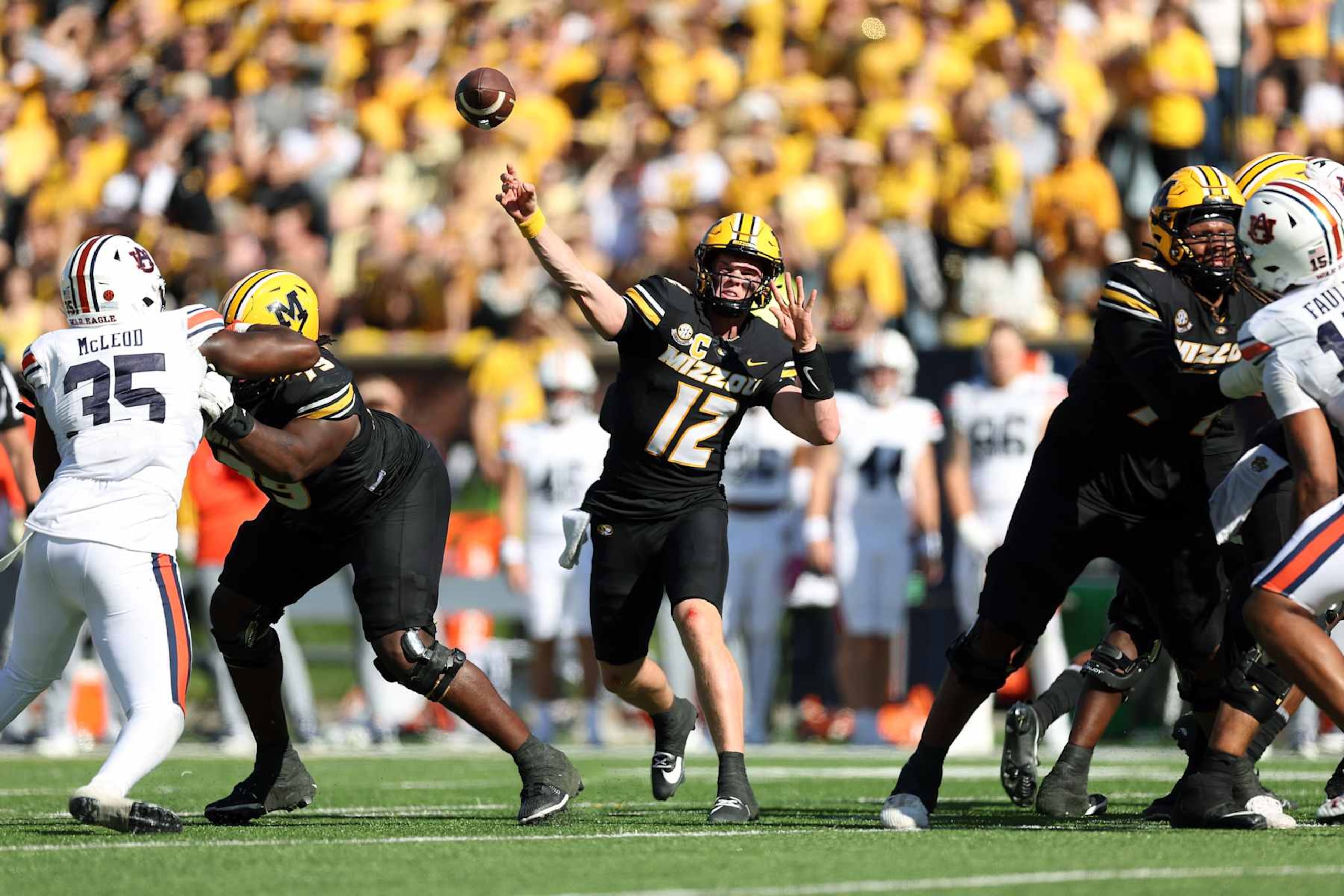 COLUMBIA, MISSOURI - OCTOBER 19:  Quarterback Brady Cook #12 of the Missouri Tigers passes during the 2nd half of the game against the Auburn Tigers at Faurot Field/Memorial Stadium on October 19, 2024 in Columbia, Missouri.  (Photo by Jamie Squire/Getty Images)