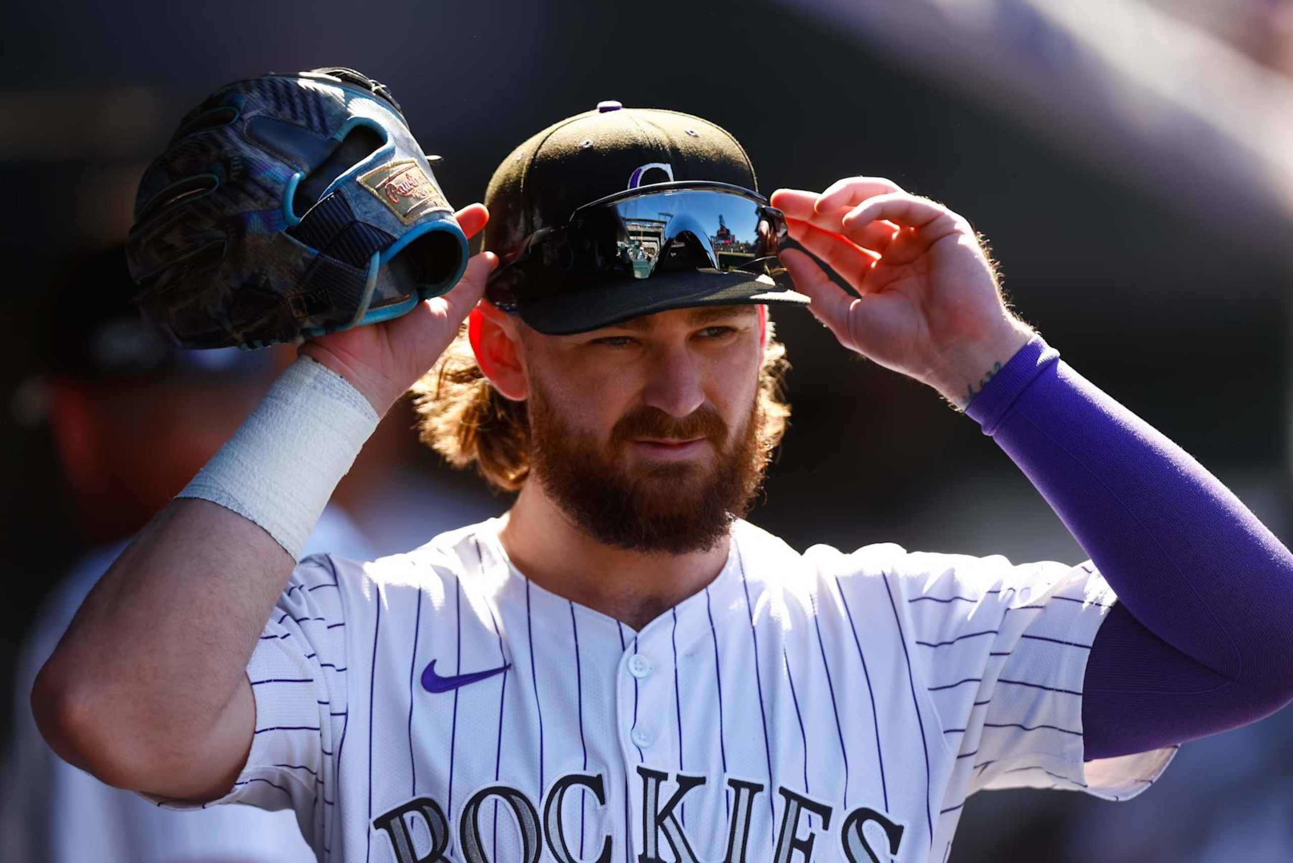 DENVER, CO - SEPTEMBER 18:  Brendan Rodgers #7 of the Colorado Rockies adjusts his hat before the sixth inning against the Arizona Diamondbacks at Coors Field on September 18, 2024 in Denver, Colorado. (Photo by Justin Edmonds/Getty Images)