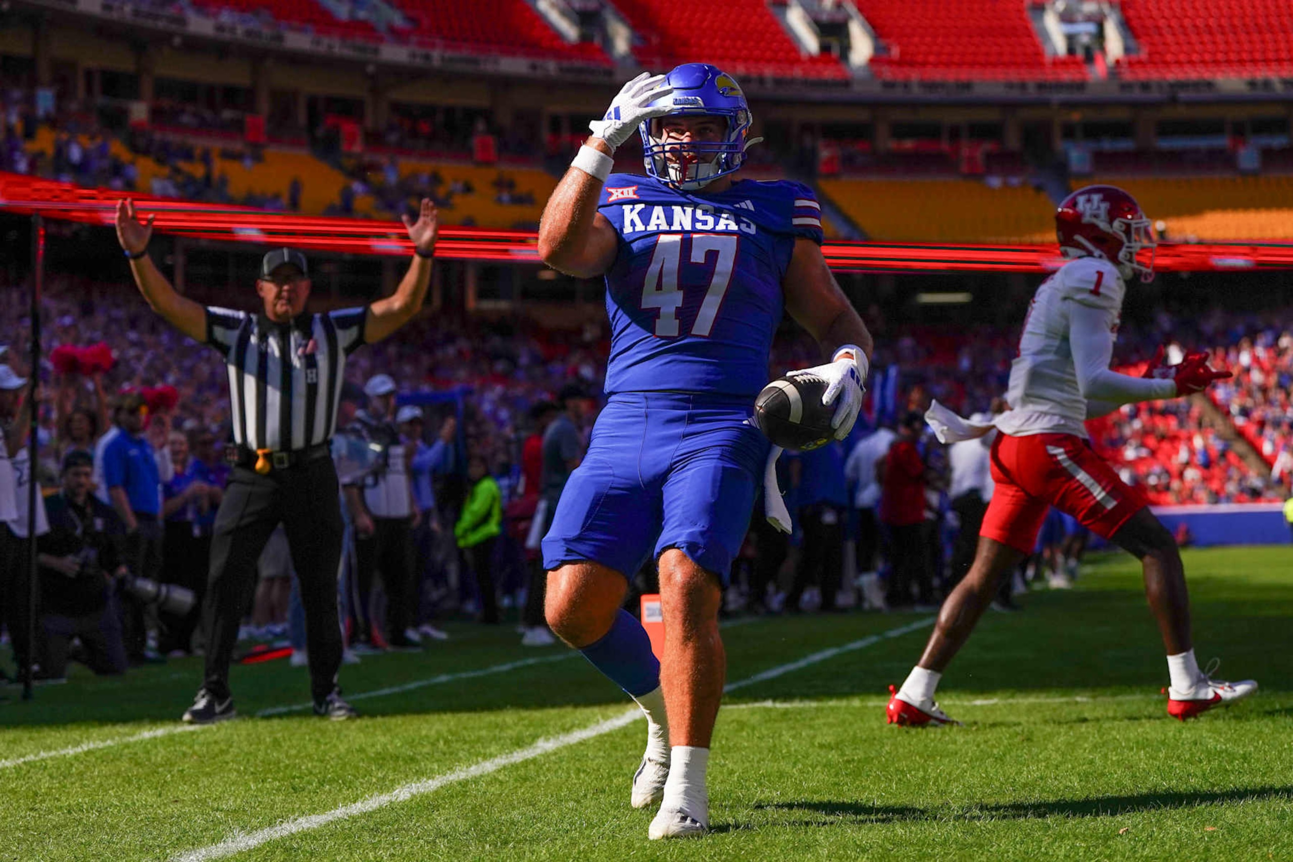 KANSAS CITY, MISSOURI - OCTOBER 19: Tight end Jared Casey #47 of the Kansas Jayhawks scores a touchdown against the Houston Cougars during the first quarter at Arrowhead Stadium on October 19, 2024 in Kansas City, Missouri.  (Photo by Kyle Rivas/Getty Images)