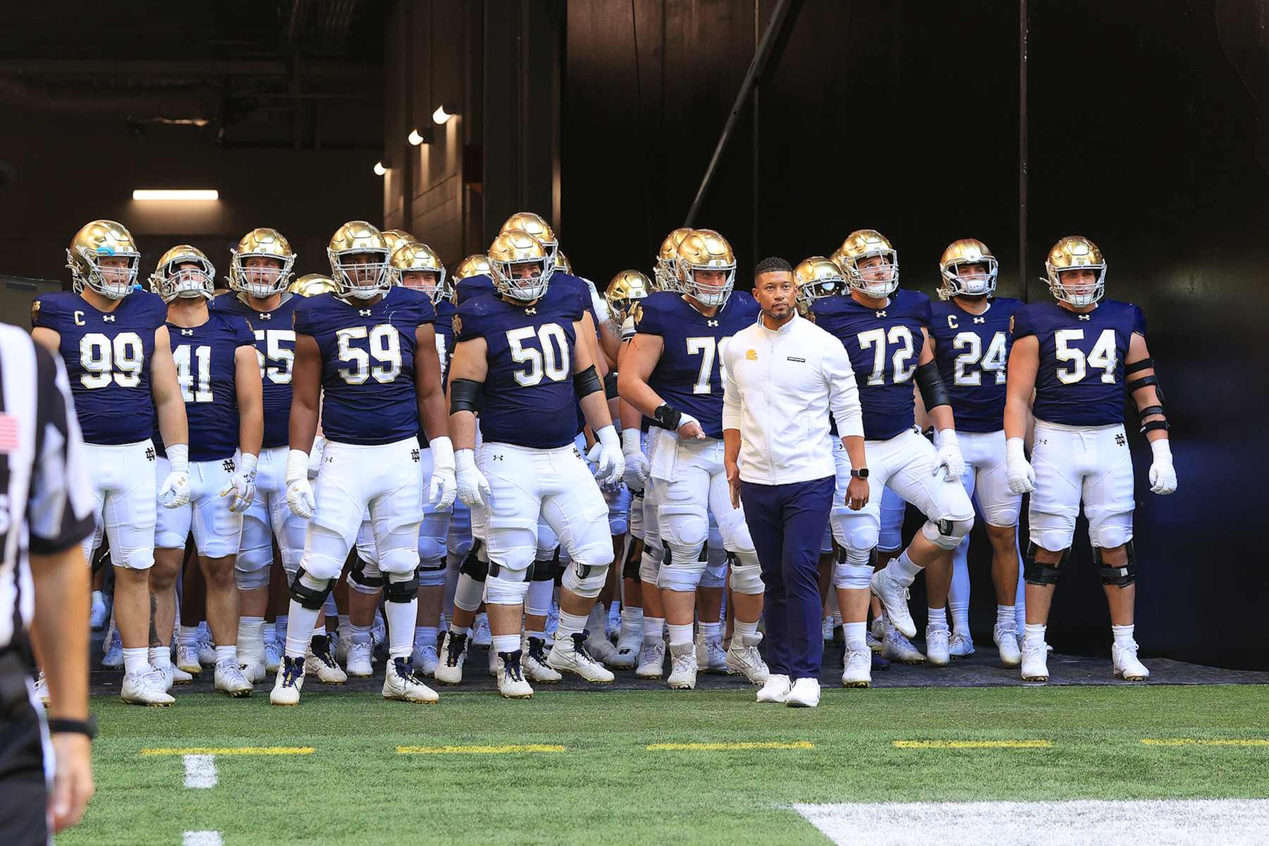 ATLANTA, GA - OCTOBER 19: Notre Dame Fighting Irish head coach Marcus Freeman gets ready to lead his team onto the field for the college football game between the Georgia Tech Yellow Jackets and the Notre Dame Fighting Irish on October 19, 2024 at the Mercedes-Benz Stadium in Atlanta, Georgia.  (Photo by David J. Griffin/Icon Sportswire via Getty Images)