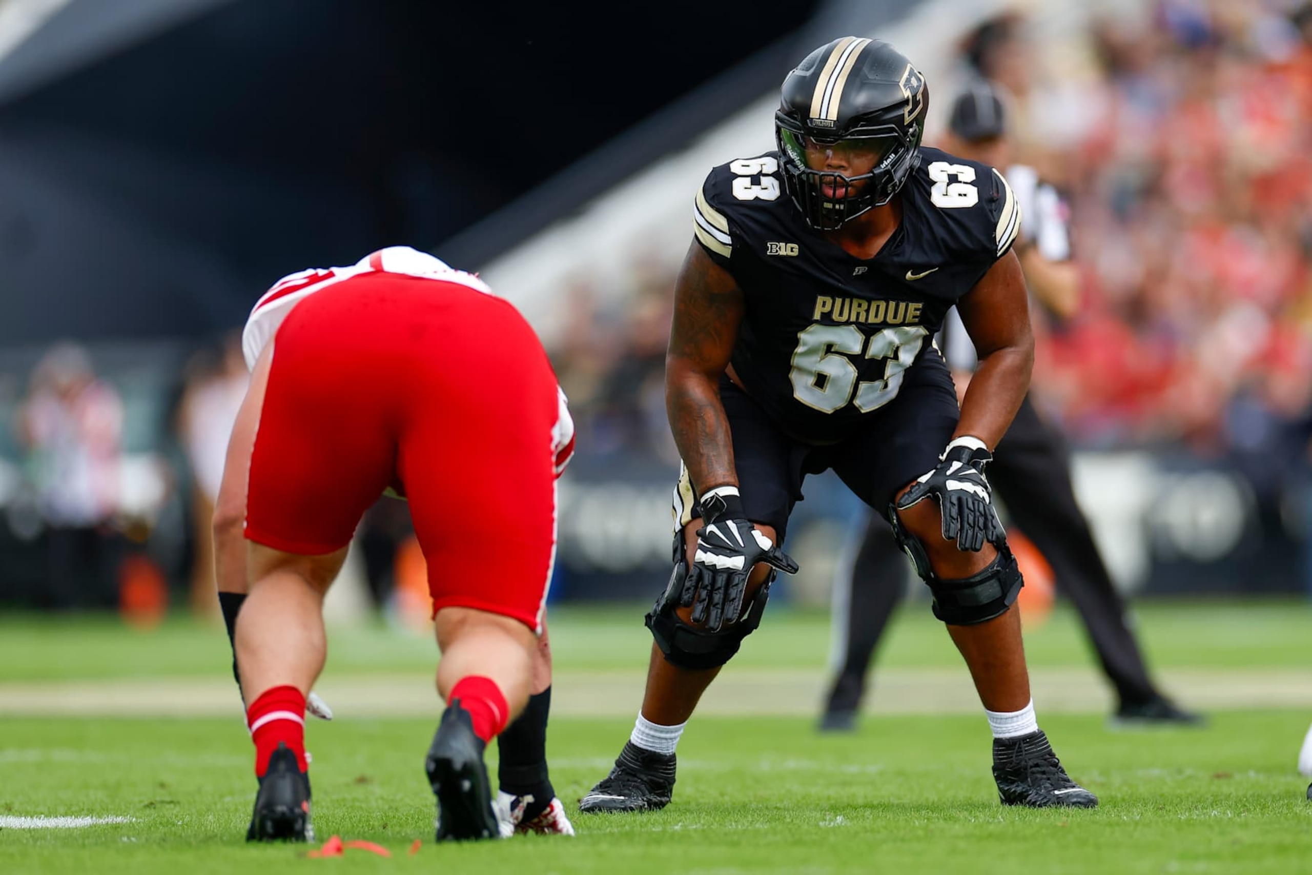 WEST LAFAYETTE, INDIANA - SEPTEMBER 28: Marcus Mbow #63 of the Purdue Boilermakers gets set for the snap during a game against the Nebraska Cornhuskers at Ross-Ade Stadium on September 28, 2024 in West Lafayette, Indiana. (Photo by Brandon Sloter/Image Of Sport/Getty Images)