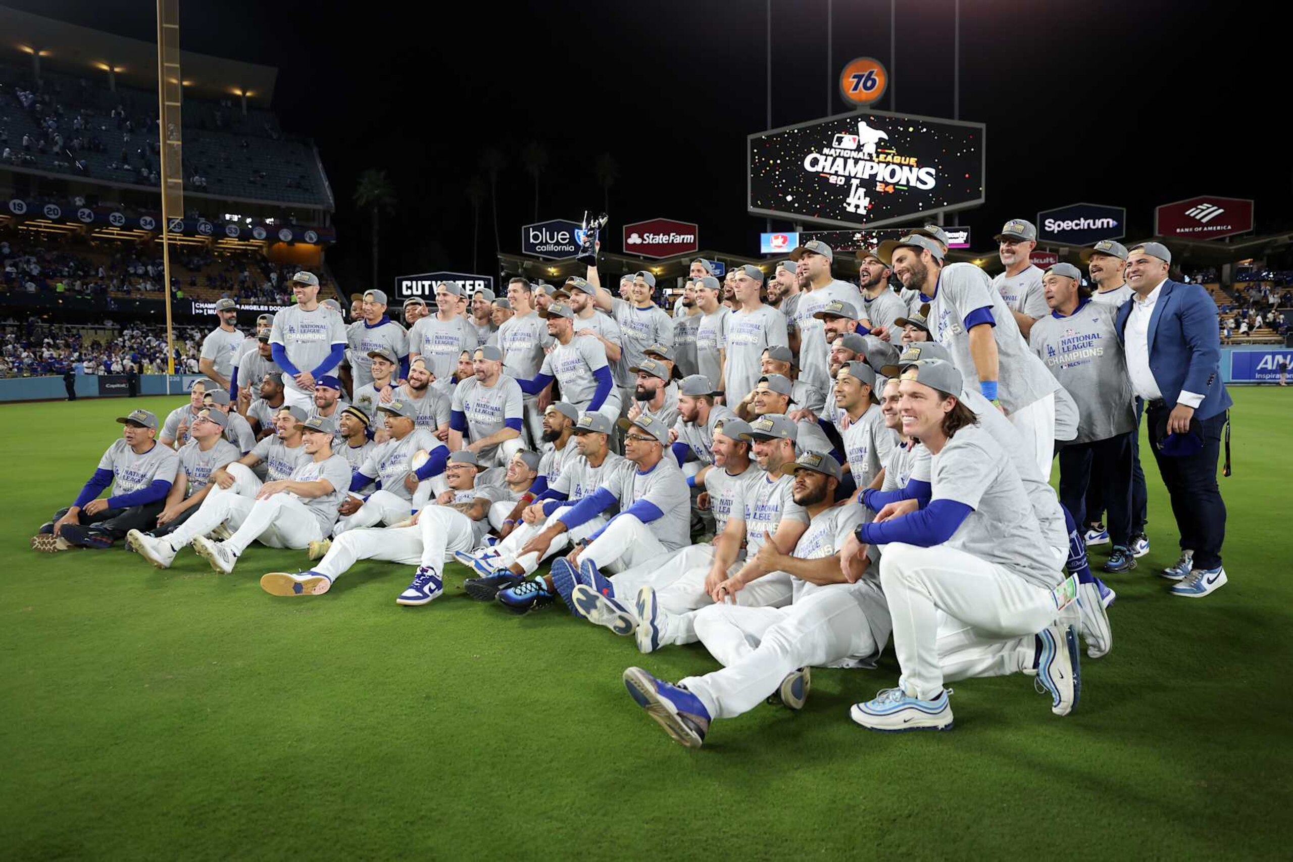 LOS ANGELES, CALIFORNIA - OCTOBER 20: The Los Angeles Dodgers pose on the field after defeating the New York Mets to win Game Six of the National League Championship Series at Dodger Stadium on October 20, 2024 in Los Angeles, California. (Photo by Sean M. Haffey/Getty Images)