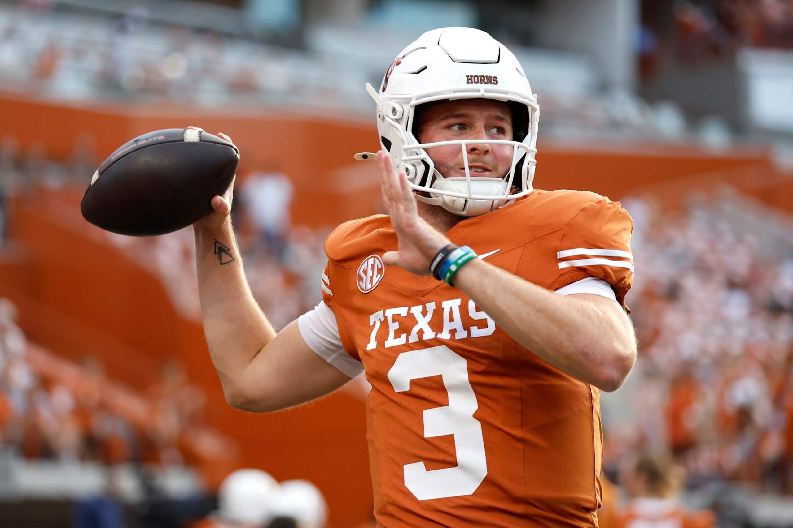 AUSTIN, TEXAS - OCTOBER 19: Quinn Ewers #3 of the Texas Longhorns warms-up prior to a game against the Georgia Bulldogs at Darrell K Royal-Texas Memorial Stadium on October 19, 2024 in Austin, Texas. (Photo by Tim Warner/Getty Images) AUSTIN, TEXAS - OCTOBER 19: Quinn Ewers #3 of the Texas Longhorns warms-up prior to a game against the Georgia Bulldogs at Darrell K Royal-Texas Memorial Stadium on October 19, 2024 in Austin, Texas. (Photo by Tim Warner/Getty Images)