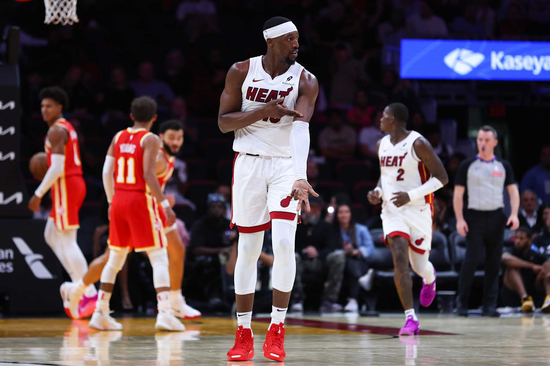 MIAMI, FLORIDA - OCTOBER 16: Bam Adebayo #13 of the Miami Heat reacts during the second quarter of a preseason game against the Atlanta Hawks at Kaseya Center on October 16, 2024 in Miami, Florida. NOTE TO USER: User expressly acknowledges and agrees that, by downloading and or using this photograph, User is consenting to the terms and conditions of the Getty Images License Agreement. (Photo by Megan Briggs/Getty Images)