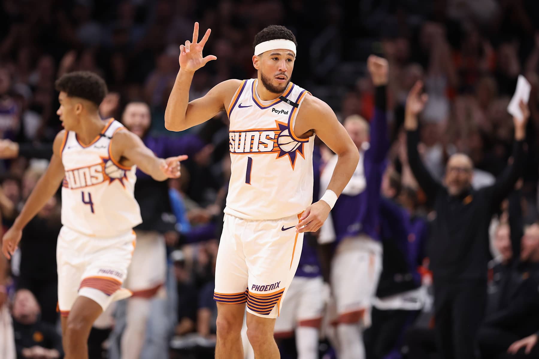 PHOENIX, ARIZONA - OCTOBER 17: Devin Booker #1 of the Phoenix Suns reacts to a three-point shot against the Los Angeles Lakers during the first half of the preseason NBA game at Footprint Center on October 17, 2024 in Phoenix, Arizona. NOTE TO USER: User expressly acknowledges and agrees that, by downloading and/or using this photograph, user is consenting to the terms and conditions of the Getty Images License Agreement.  (Photo by Christian Petersen/Getty Images)