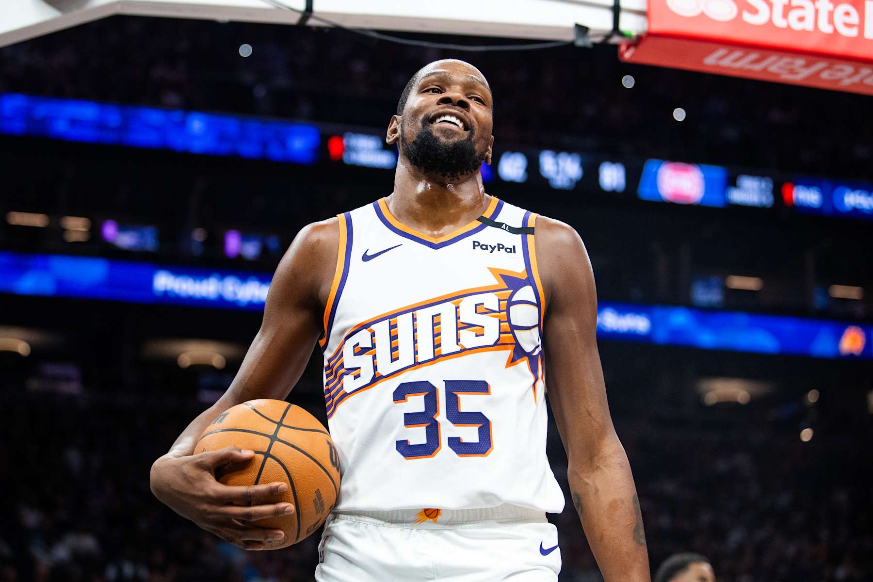 PHOENIX, ARIZONA - OCTOBER 11: Kevin Durant #35 of the Phoenix Suns looks on during the second half of the preseason game against the Detroit Pistons at Footprint Center on October 11, 2024 in Phoenix, Arizona.  NOTE TO USER: User expressly acknowledges and agrees that, by downloading and/or using this photograph, user is consenting to the terms and conditions of the Getty Images License Agreement. (Photo by Kelsey Grant/Getty Images)