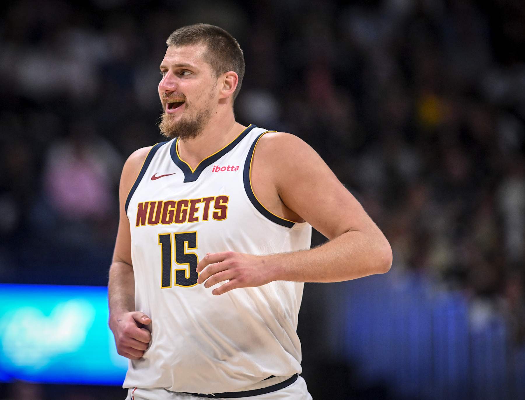 DENVER, CO - OCTOBER 13: Nikola Jokic (15) of the Denver Nuggets smiles after blowing up Mason Plumlee (22) of the Phoenix Suns during the second quarter at Ball Arena in Denver on Sunday, October 13, 2024. (Photo by AAron Ontiveroz/The Denver Post)