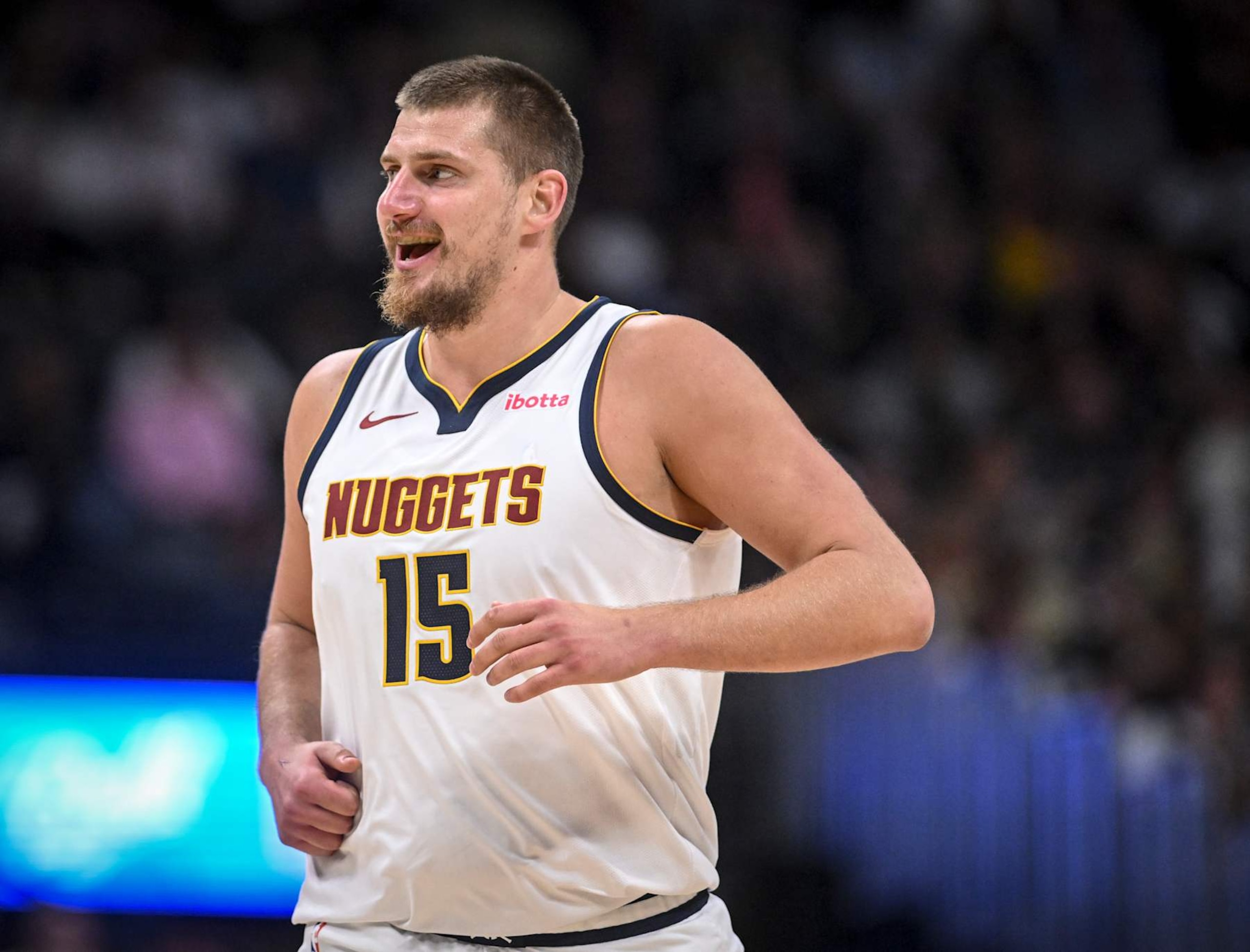 DENVER, CO - OCTOBER 13: Nikola Jokic (15) of the Denver Nuggets smiles after blowing up Mason Plumlee (22) of the Phoenix Suns during the second quarter at Ball Arena in Denver on Sunday, October 13, 2024. (Photo by AAron Ontiveroz/The Denver Post)