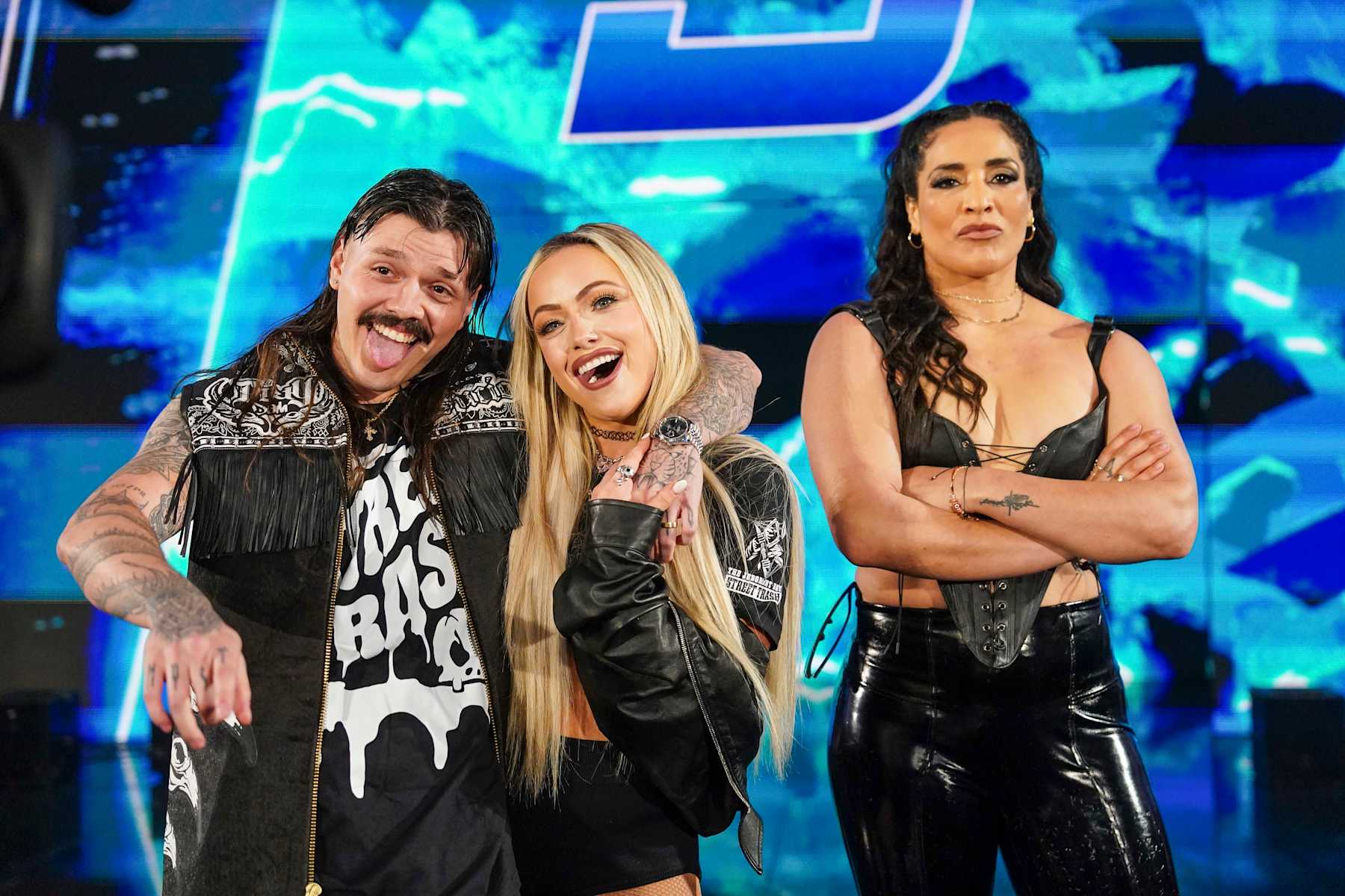 GREENVILLE, SOUTH CAROLINA - OCTOBER 11: Dom Mysterio, Liv Morgan, and Raquel Rodriguez made surprise entrance during Smackdown at Bon Secours Wellness Arena on October 11, 2024 in Greenville, South Carolina.  (Photo by WWE/Getty Images)