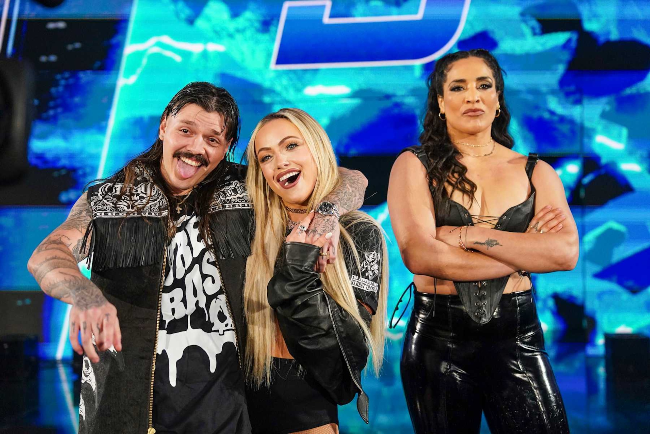 GREENVILLE, SOUTH CAROLINA - OCTOBER 11: Dom Mysterio, Liv Morgan, and Raquel Rodriguez made surprise entrance during Smackdown at Bon Secours Wellness Arena on October 11, 2024 in Greenville, South Carolina.  (Photo by WWE/Getty Images)