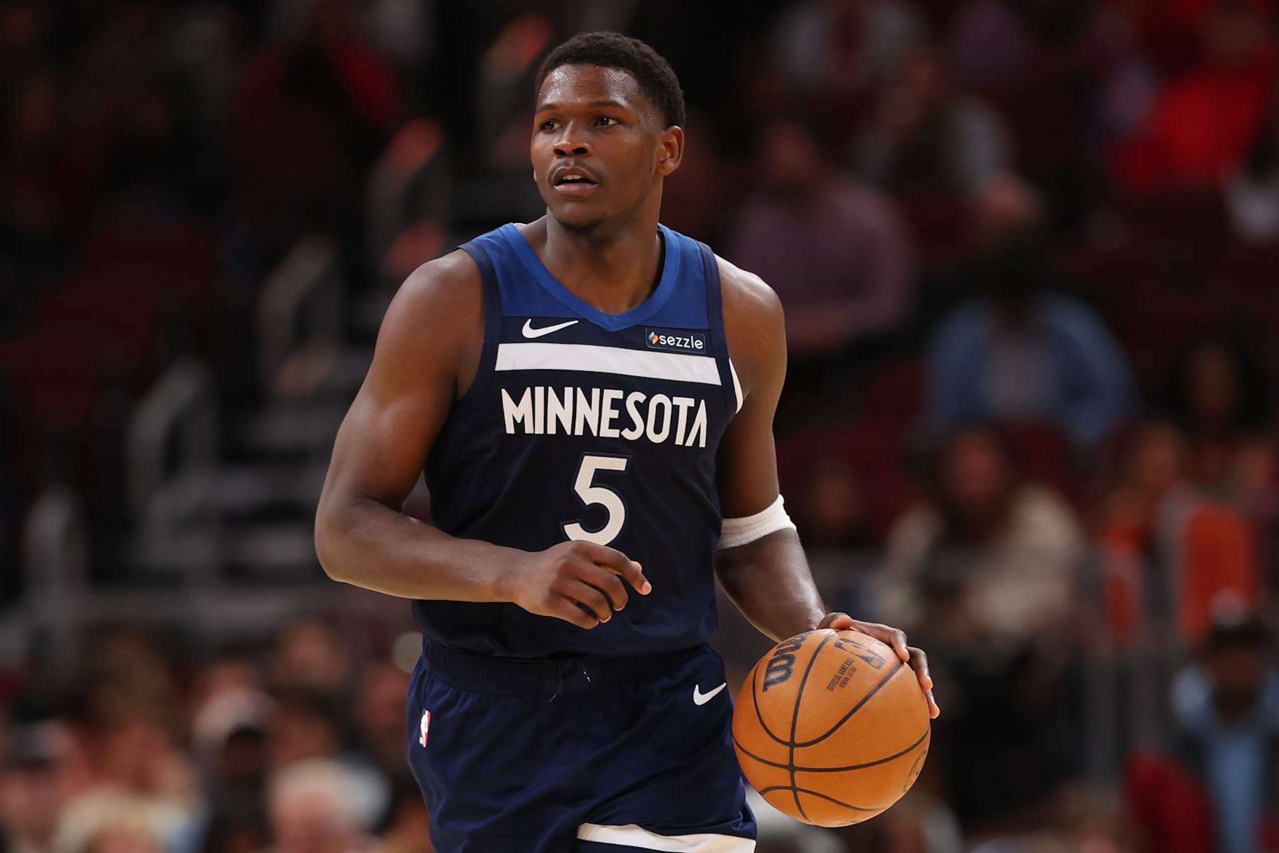 CHICAGO, ILLINOIS - OCTOBER 16: Anthony Edwards #5 of the Minnesota Timberwolves dribbles up the court against the Chicago Bulls during the second half of a preseason game at the United Center on October 16, 2024 in Chicago, Illinois. NOTE TO USER: User expressly acknowledges and agrees that, by downloading and or using this photograph, User is consenting to the terms and conditions of the Getty Images License Agreement. (Photo by Michael Reaves/Getty Images) CHICAGO, ILLINOIS - OCTOBER 16: Anthony Edwards #5 of the Minnesota Timberwolves dribbles up the court against the Chicago Bulls during the second half of a preseason game at the United Center on October 16, 2024 in Chicago, Illinois. NOTE TO USER: User expressly acknowledges and agrees that, by downloading and or using this photograph, User is consenting to the terms and conditions of the Getty Images License Agreement. (Photo by Michael Reaves/Getty Images)