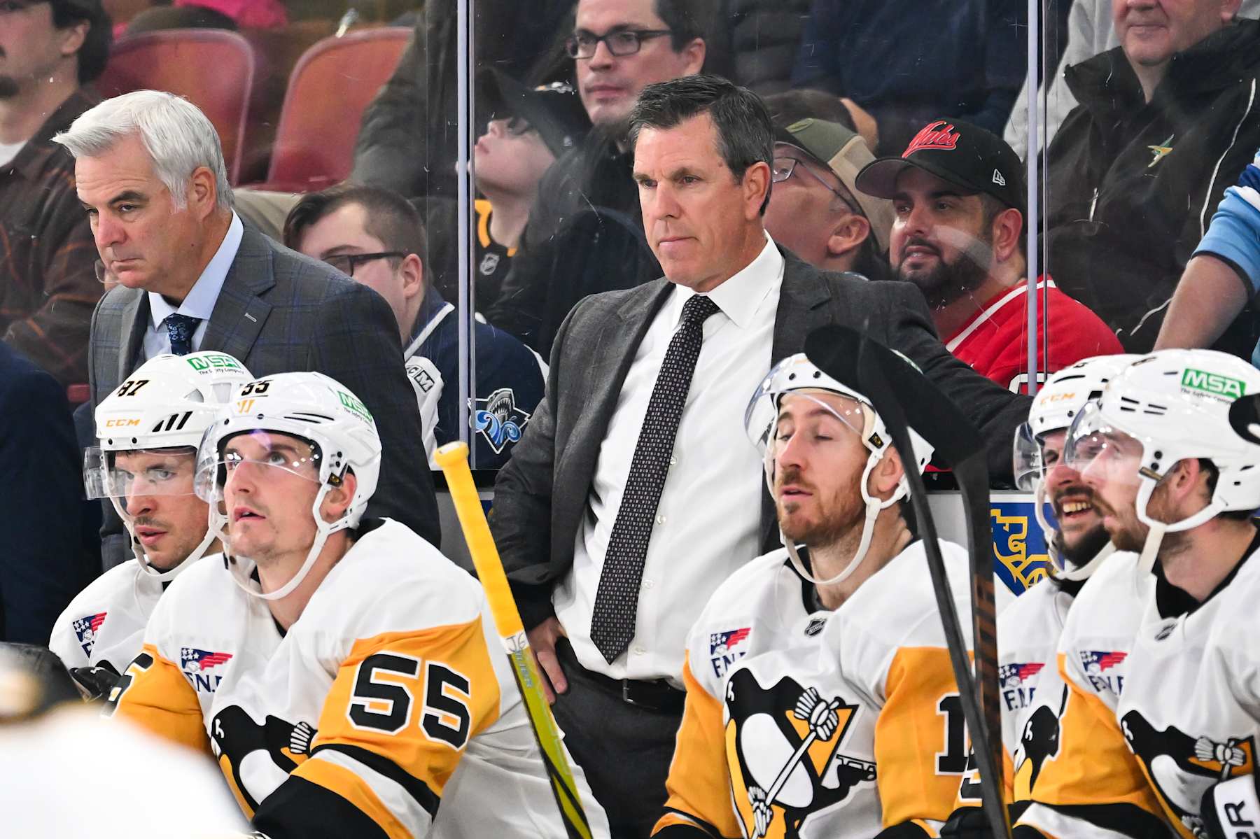 MONTREAL, CANADA - OCTOBER 14:  Head coach Mike Sullivan of the Pittsburgh Penguins handles bench duties during the second period against the Montreal Canadiens at the Bell Centre on October 14, 2024 in Montreal, Quebec, Canada.  The Pittsburgh Penguins defeated the Montreal Canadiens 6-3.  (Photo by Minas Panagiotakis/Getty Images)
