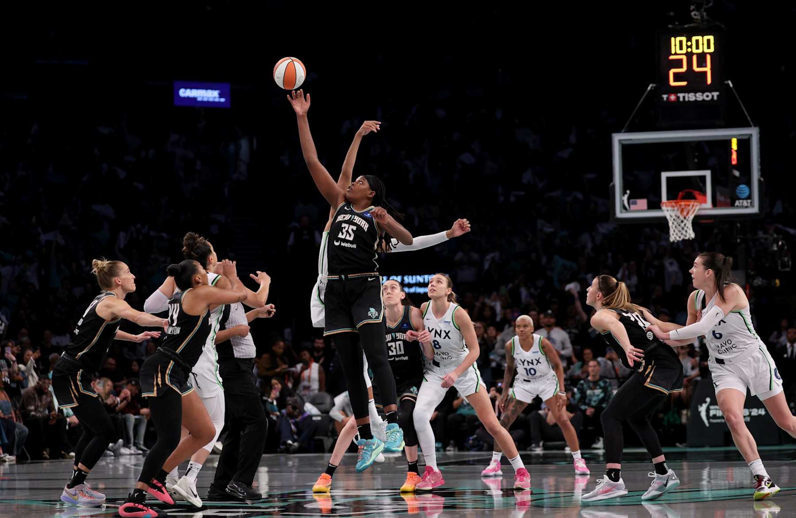 NEW YORK, NEW YORK - OCTOBER 20: Jonquel Jones #35 of the New York Liberty and Kayla McBride #21 of the Minnesota Lynx tip off to start Game Five of the WNBA Finals at Barclays Center on October 20, 2024 in the Brooklyn borough of New York City. The New York Liberty defeated the Minnesota Lynx 67-62 in overtime to win the championship. NOTE TO USER: User expressly acknowledges and agrees that, by downloading and or using this photograph, User is consenting to the terms and conditions of the Getty Images License Agreement. (Photo by Elsa/Getty Images)