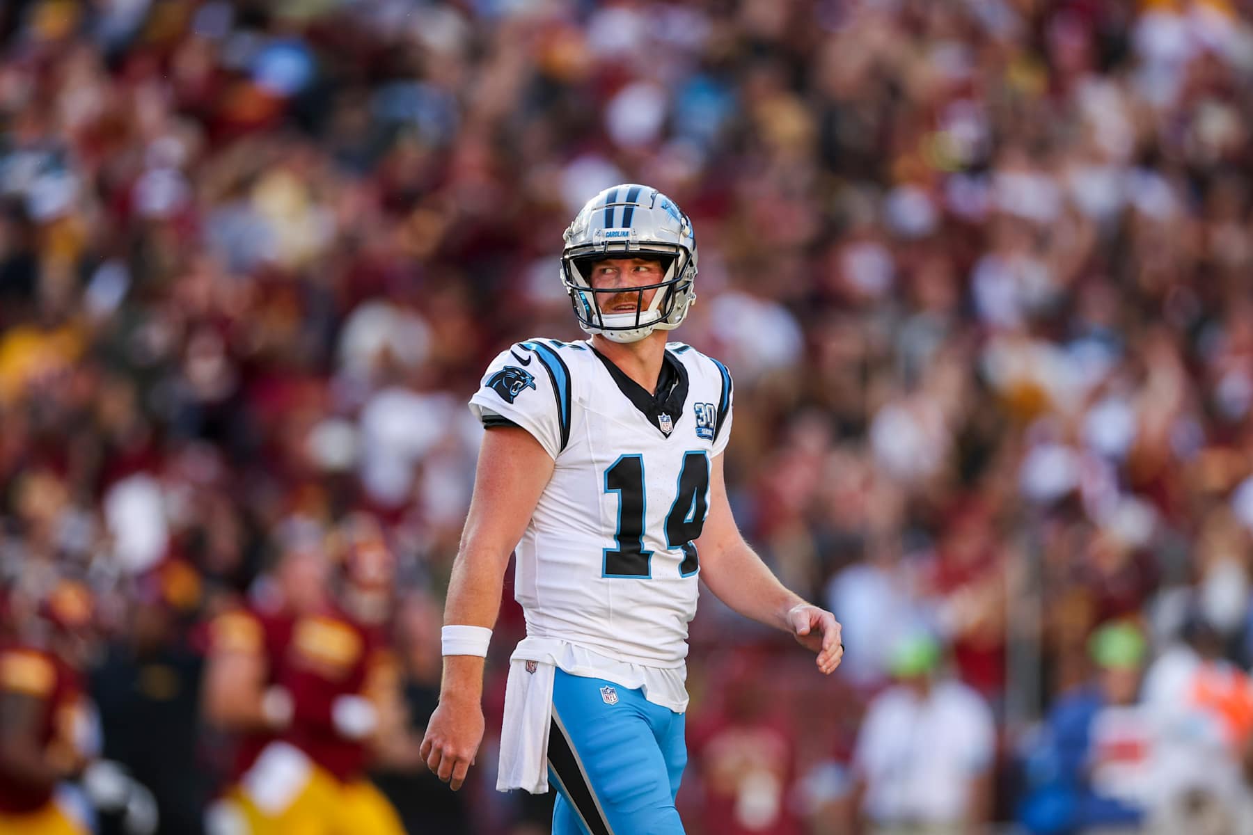 LANDOVER, MARYLAND - OCTOBER 20: Andy Dalton #14 of the Carolina Panthers reacts after throwing a pick six against the Washington Commanders during the first quarter at Northwest Stadium on October 20, 2024 in Landover, Maryland. (Photo by Patrick Smith/Getty Images)