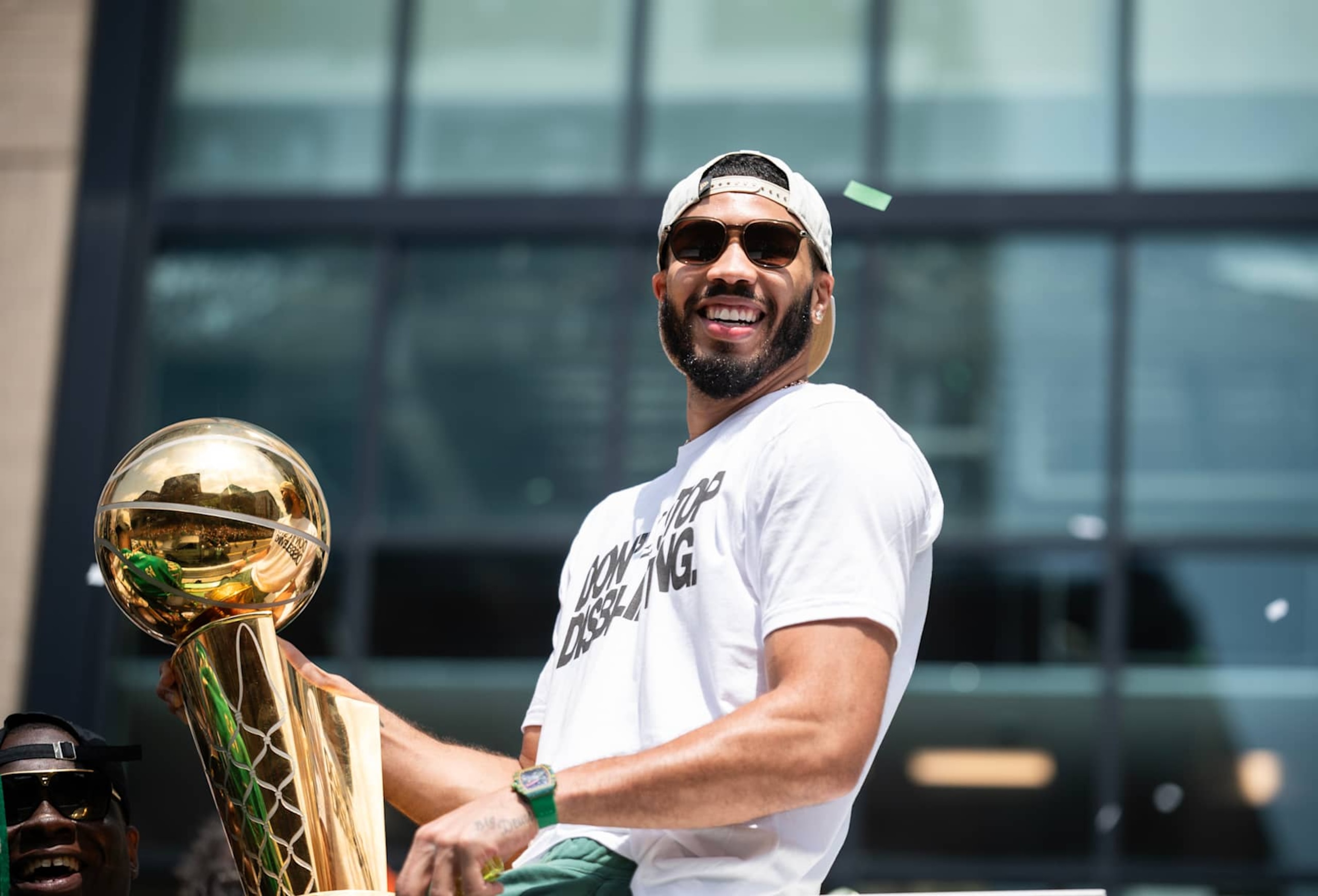 BOSTON, MA - JUNE 21: Jayson Tatum #0 of the Boston Celtics celebrates with the Larry O'Brien Trophy during the 2024 Boston Celtics championship parade on June 21, 2024 in Boston, Massachusetts. NOTE TO USER: User expressly acknowledges and agrees that, by downloading and or using this photograph, User is consenting to the terms and conditions of the Getty Images License Agreement. Mandatory Copyright Notice: Copyright 2024 NBAE (Photo by China Wong/NBAE via Getty Images) BOSTON, MA - JUNE 21: Jayson Tatum #0 of the Boston Celtics celebrates with the Larry O'Brien Trophy during the 2024 Boston Celtics championship parade on June 21, 2024 in Boston, Massachusetts. NOTE TO USER: User expressly acknowledges and agrees that, by downloading and or using this photograph, User is consenting to the terms and conditions of the Getty Images License Agreement. Mandatory Copyright Notice: Copyright 2024 NBAE (Photo by China Wong/NBAE via Getty Images)