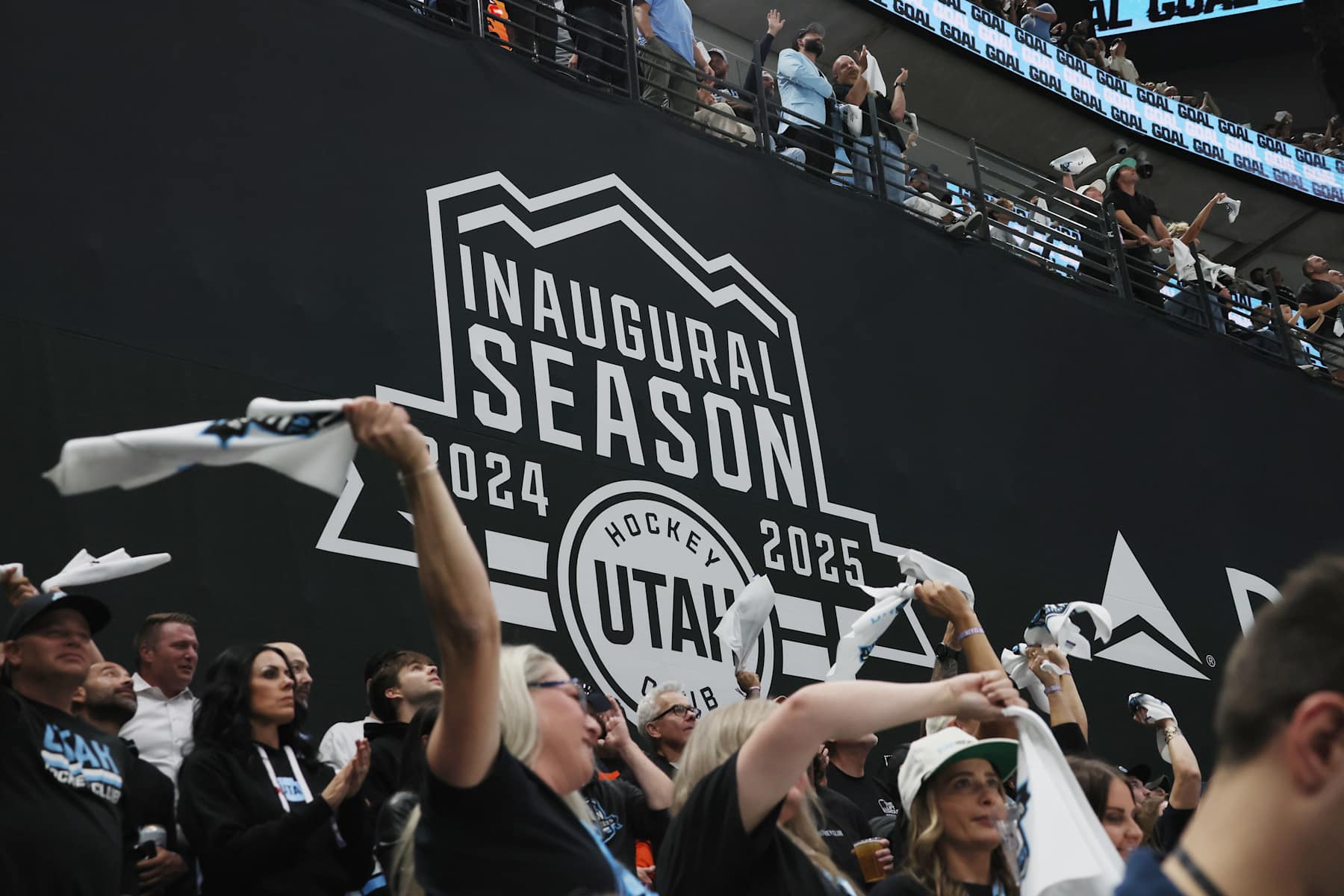 SALT LAKE CITY, UTAH - OCTOBER 08: Fans celebrate a first period goal by Clayton Keller #9 of Utah Hockey Club against the Chicago Blackhawks at Delta Center on October 08, 2024 in Salt Lake City, Utah. This game is the first for the franchise in Utah following their relocation from Arizona. (Photo by Bruce Bennett/Getty Images)