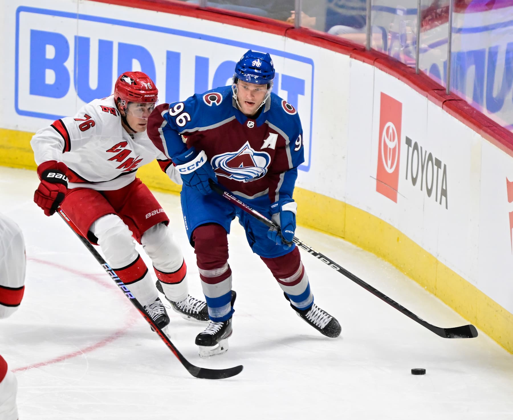 DENVER, CO - OCTOBER 21: Colorado Avalanche right wing Mikko Rantanen (96) looks up ice to pass against Carolina Hurricanes defenseman Brady Skjei (76) in first period at Ball Arena  October 21, 2023. (Photo by Andy Cross/MediaNews Group/The Denver Post via Getty Images)