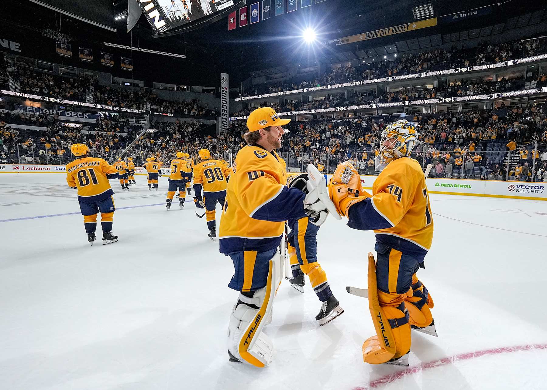 NASHVILLE, TENNESSEE - OCTOBER 22: Scott Wedgewood #41 congratulates Juuse Saros #74 of the Nashville Predators on his 4-0 shutout against the Boston Bruins during an NHL game at Bridgestone Arena on October 22, 2024 in Nashville, Tennessee. (Photo by John Russell/NHLI via Getty Images)