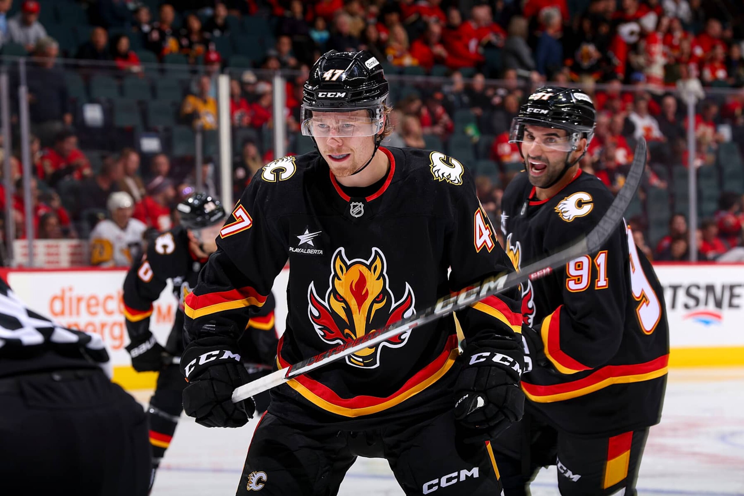 CALGARY, AB - OCTOBER 22: Connor Zary #47 of the Calgary Flames prepares to face off against the Pittsburgh Penguins at Scotiabank Saddledome on October 22, 2024 in Calgary, Alberta, Canada. (Photo by Gerry Thomas/NHLI via Getty Images) CALGARY, AB - OCTOBER 22: Connor Zary #47 of the Calgary Flames prepares to face off against the Pittsburgh Penguins at Scotiabank Saddledome on October 22, 2024 in Calgary, Alberta, Canada. (Photo by Gerry Thomas/NHLI via Getty Images)