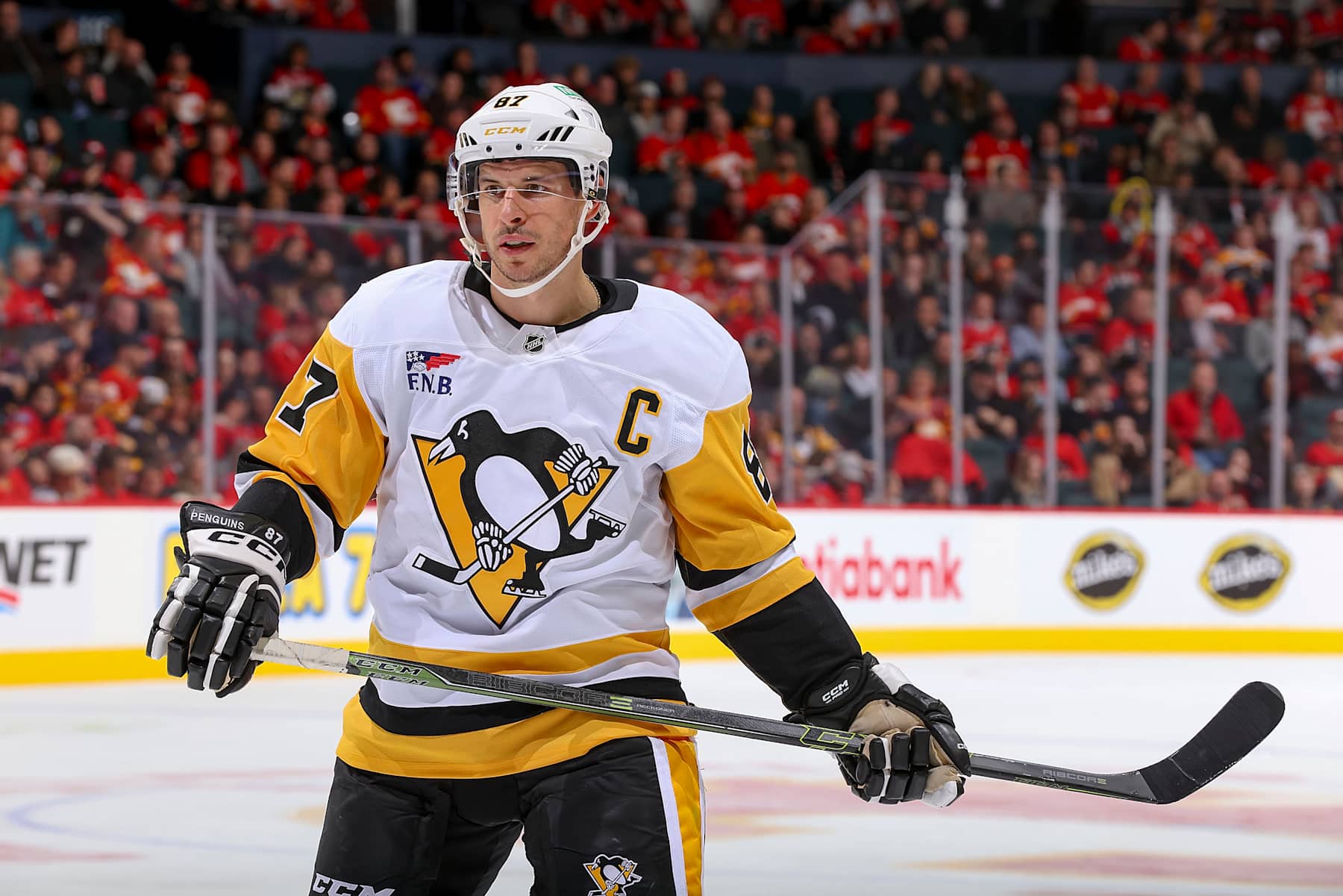 CALGARY, AB - OCTOBER 22: Sidney Crosby #87 of the Pittsburgh Penguins prepares to face off against the Calgary Flames at Scotiabank Saddledome on October 22, 2024 in Calgary, Alberta, Canada. (Photo by Gerry Thomas/NHLI via Getty Images)