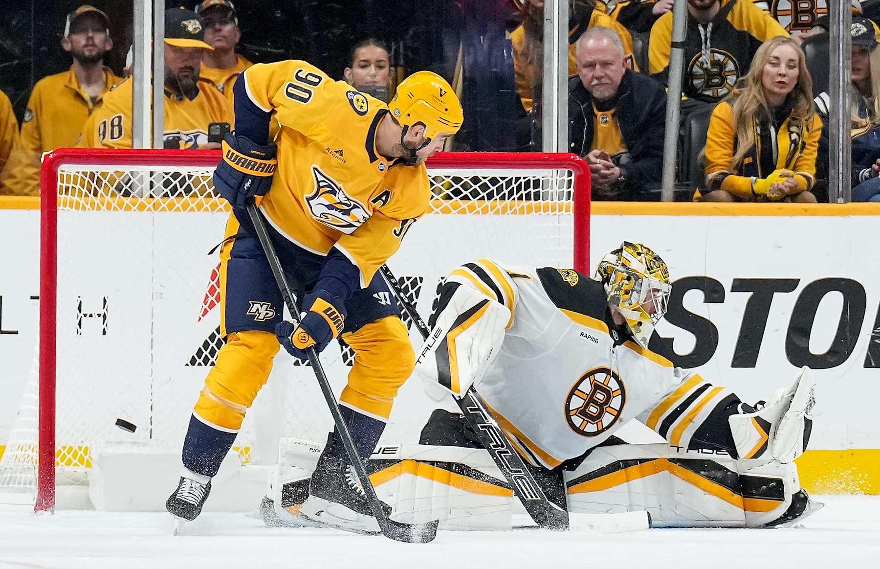 NASHVILLE, TENNESSEE - OCTOBER 22: Ryan O'Reilly #90 of the Nashville Predators scores on a tip against Jeremy Swayman #1 of the Boston Bruins during an NHL game at Bridgestone Arena on October 22, 2024 in Nashville, Tennessee. (Photo by John Russell/NHLI via Getty Images)