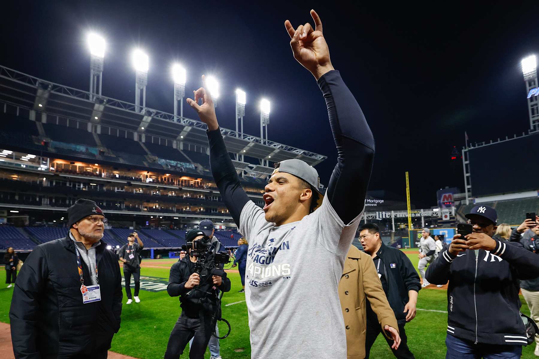 CLEVELAND, OH - OCTOBER 19: Juan Soto #22 of the New York Yankees interacts with fans after defeating the Cleveland Guardians in Game 5 of the ALCS presented by loanDepot at Progressive Field on Saturday, October 19, 2024 in Cleveland, Ohio. (Photo by Lauren Leigh Bacho/MLB Photos via Getty Images)