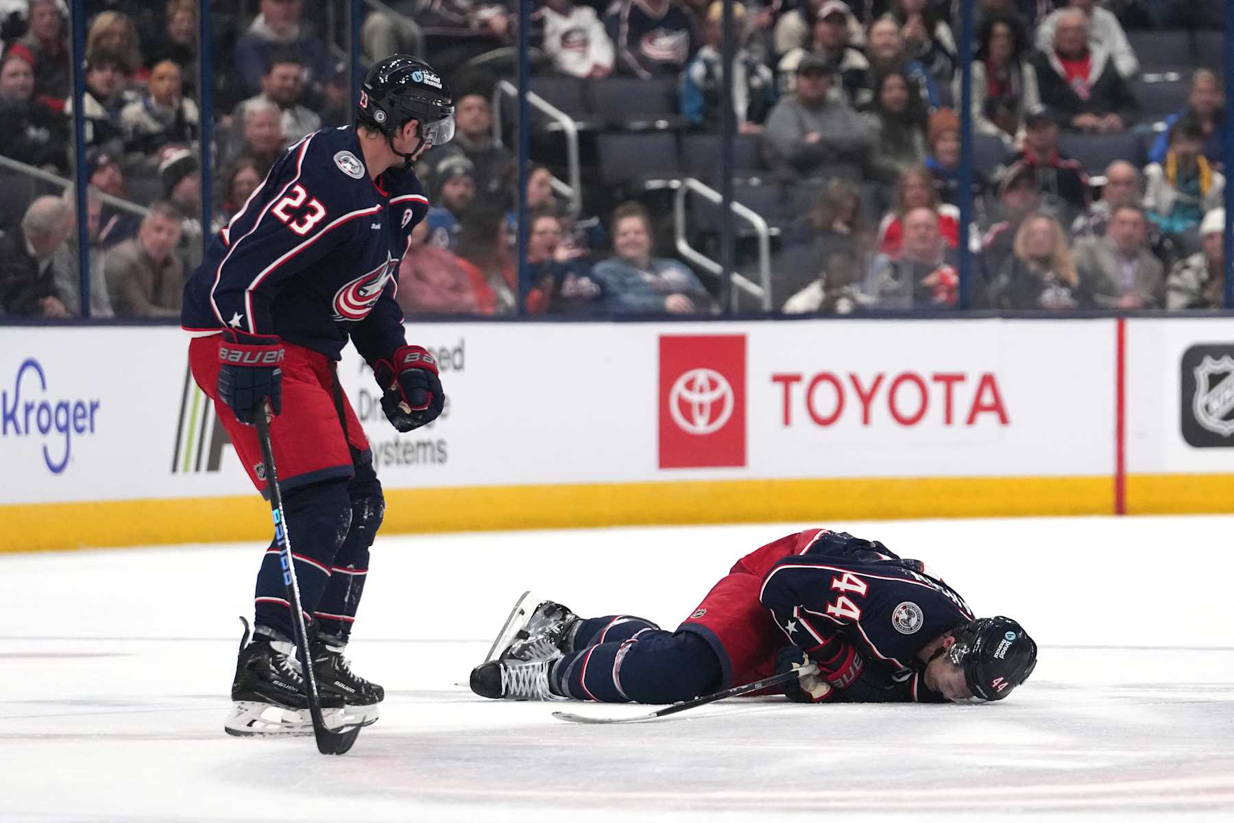 COLUMBUS, OHIO - OCTOBER 15: Erik Gudbranson #44 of the Columbus Blue Jackets lies on the ice after colliding with teammate Sean Monahan #23 during the second period against the Florida Panthers at Nationwide Arena on October 15, 2024 in Columbus, Ohio. (Photo by Jason Mowry/Getty Images)