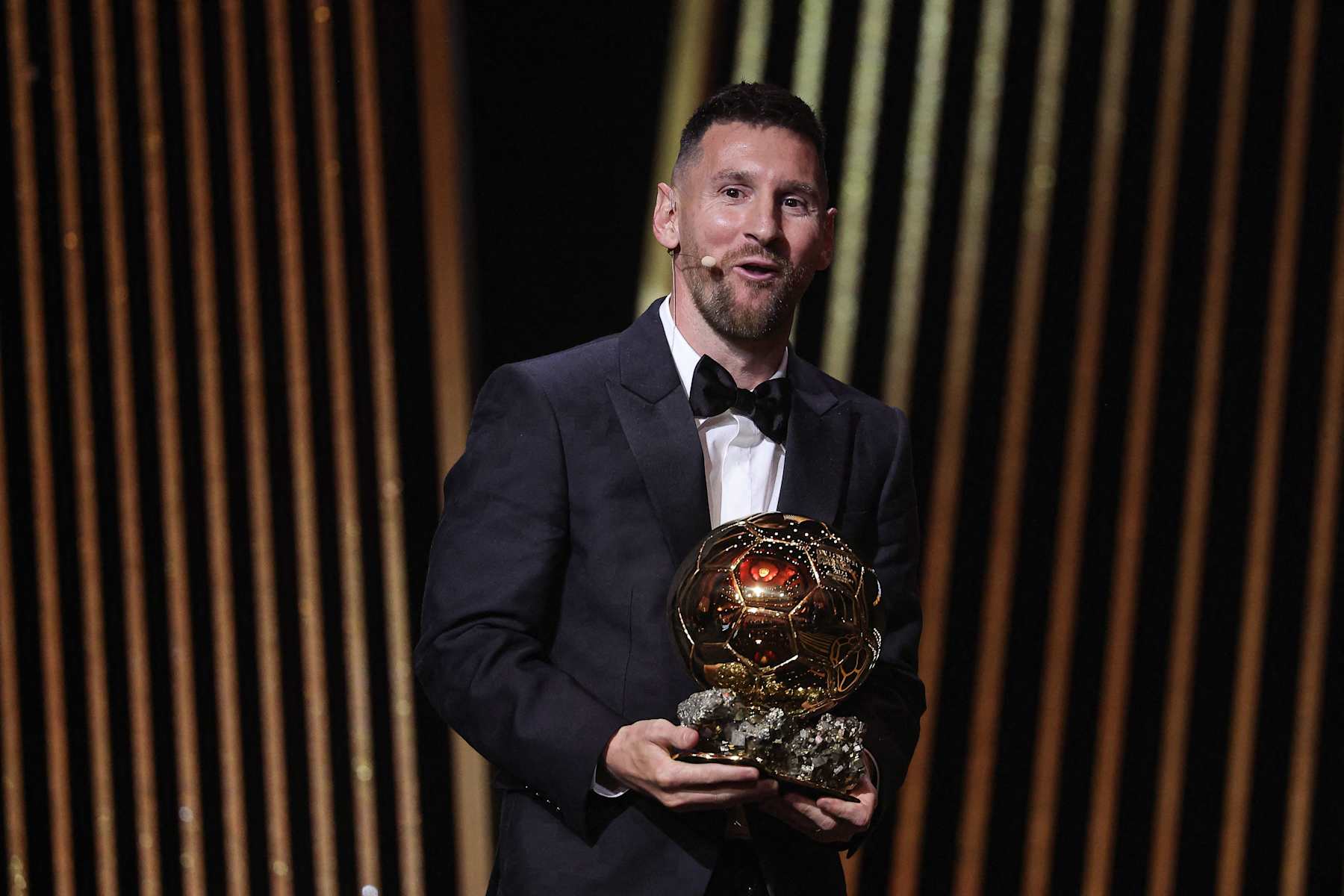 Inter Miami CF's Argentine forward Lionel Messi reacts on stage with his trophy as he receives his 8th Ballon d'Or award during the 2023 Ballon d'Or France Football award ceremony at the Theatre du Chatelet in Paris on October 30, 2023. (Photo by FRANCK FIFE / AFP) (Photo by FRANCK FIFE/AFP via Getty Images)