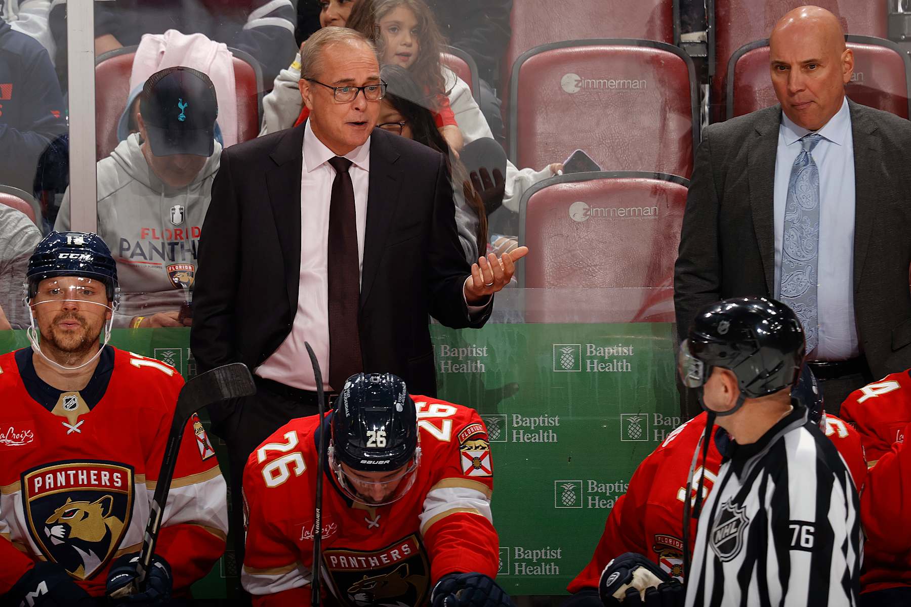SUNRISE, FL - OCTOBER 17: Head coach Paul Maurice of the Florida Panthers talks to linesman Michel Cormier #76 during a break in action against the Vancouver Canucks during the third period at the Amerant Bank Arena on October 17, 2024 in Sunrise, Florida. (Photo by Joel Auerbach/Getty Images)