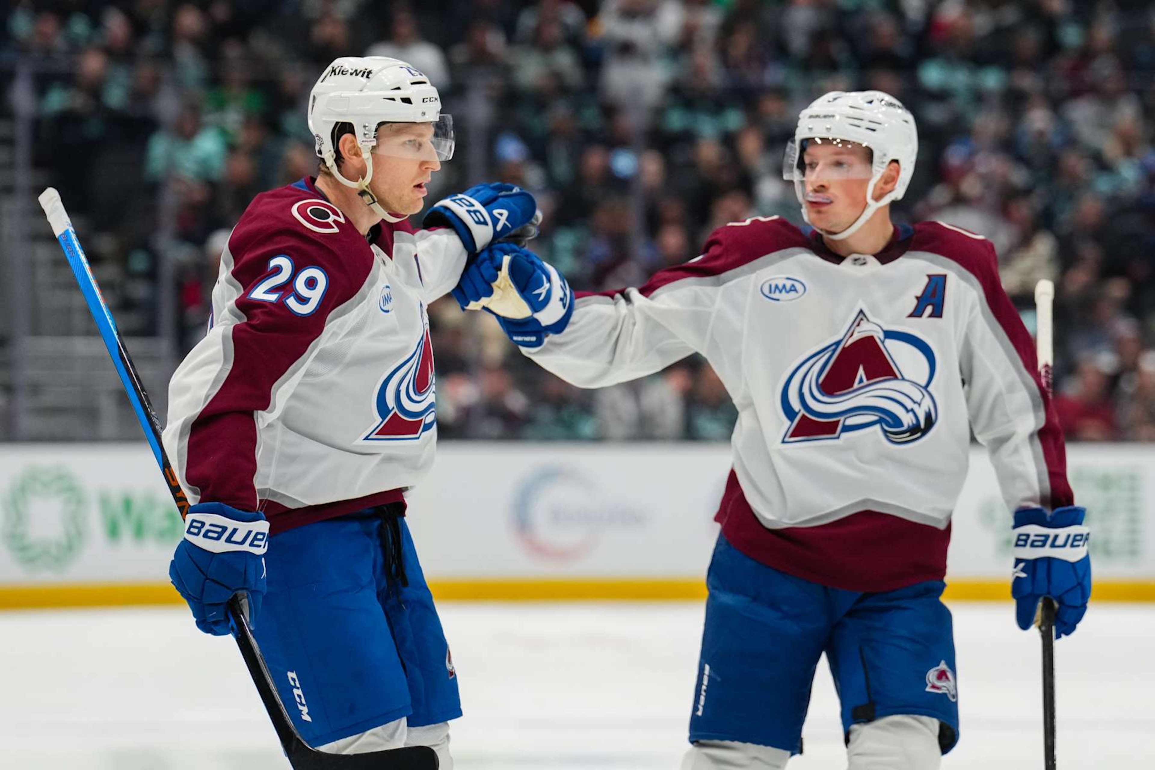 SEATTLE, WASHINGTON - OCTOBER 22: Nathan MacKinnon #29 celebrates with Cale Makar #8 of the Colorado Avalanche after scoring a goal during the second period of a game at Climate Pledge Arena on October 22, 2024 in Seattle, Washington. (Photo by Christopher Mast/NHLI via Getty Images) SEATTLE, WASHINGTON - OCTOBER 22: Nathan MacKinnon #29 celebrates with Cale Makar #8 of the Colorado Avalanche after scoring a goal during the second period of a game at Climate Pledge Arena on October 22, 2024 in Seattle, Washington. (Photo by Christopher Mast/NHLI via Getty Images)