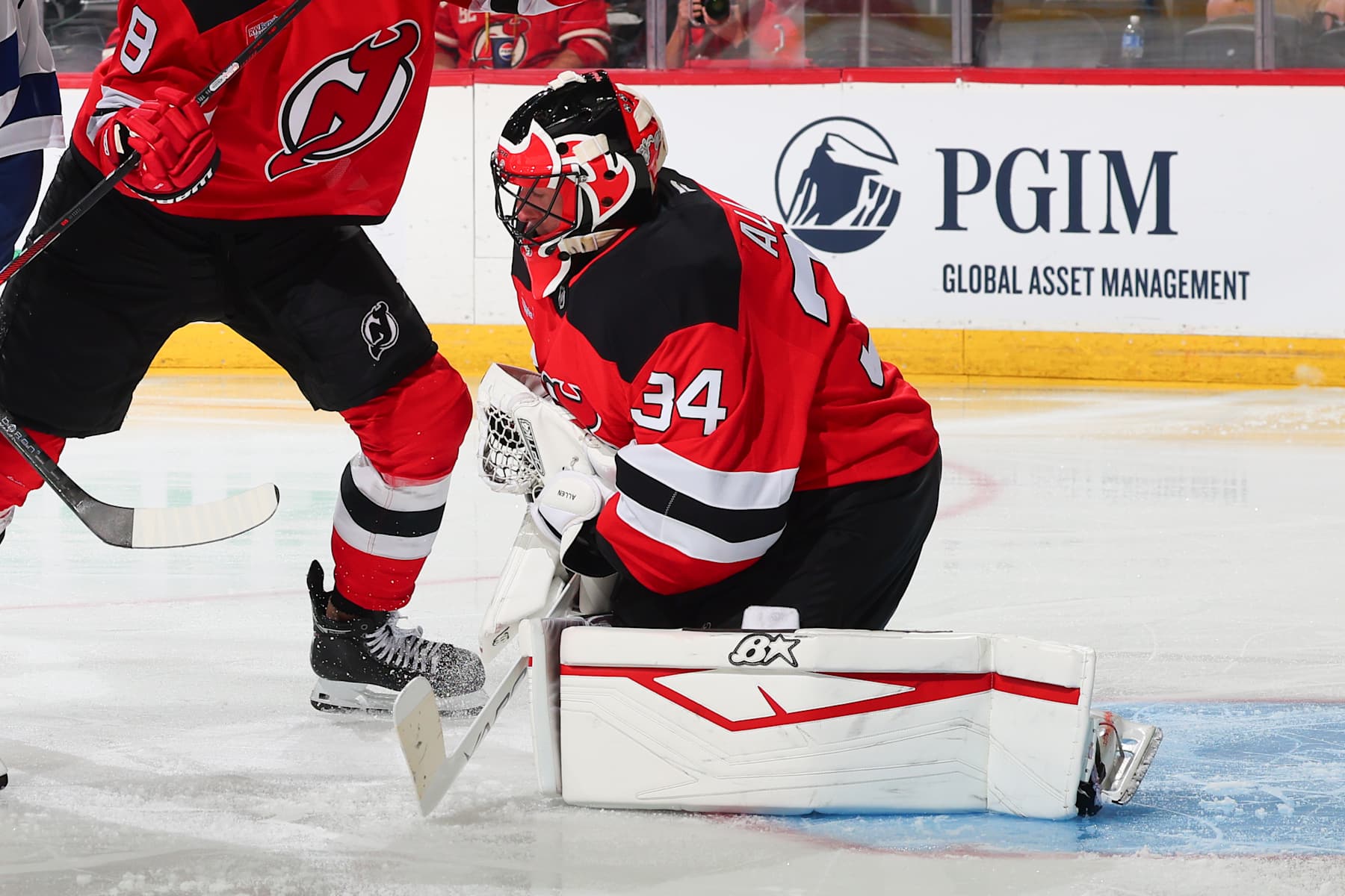 NEWARK, NJ - OCTOBER 22: Jake Allen #34 of the New Jersey Devils defends his net in the second period of the game against the Tampa Bay Lightning at the Prudential Center on October 22, 2024 in Newark, New Jersey.  (Photo by Rich Graessle/NHLI via Getty Images)