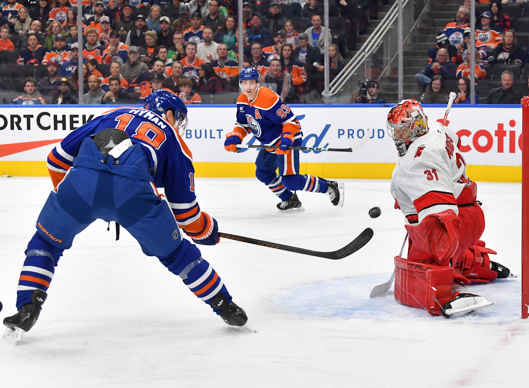 EDMONTON, CANADA - OCTOBER 22: Frederik Andersen #31 of the Carolina Hurricanes makes a save against Zach Hyman #18 of the Edmonton Oilers during the game at Rogers Place on October 22, 2024, in Edmonton, Alberta, Canada. (Photo by Andy Devlin/NHLI via Getty Images)