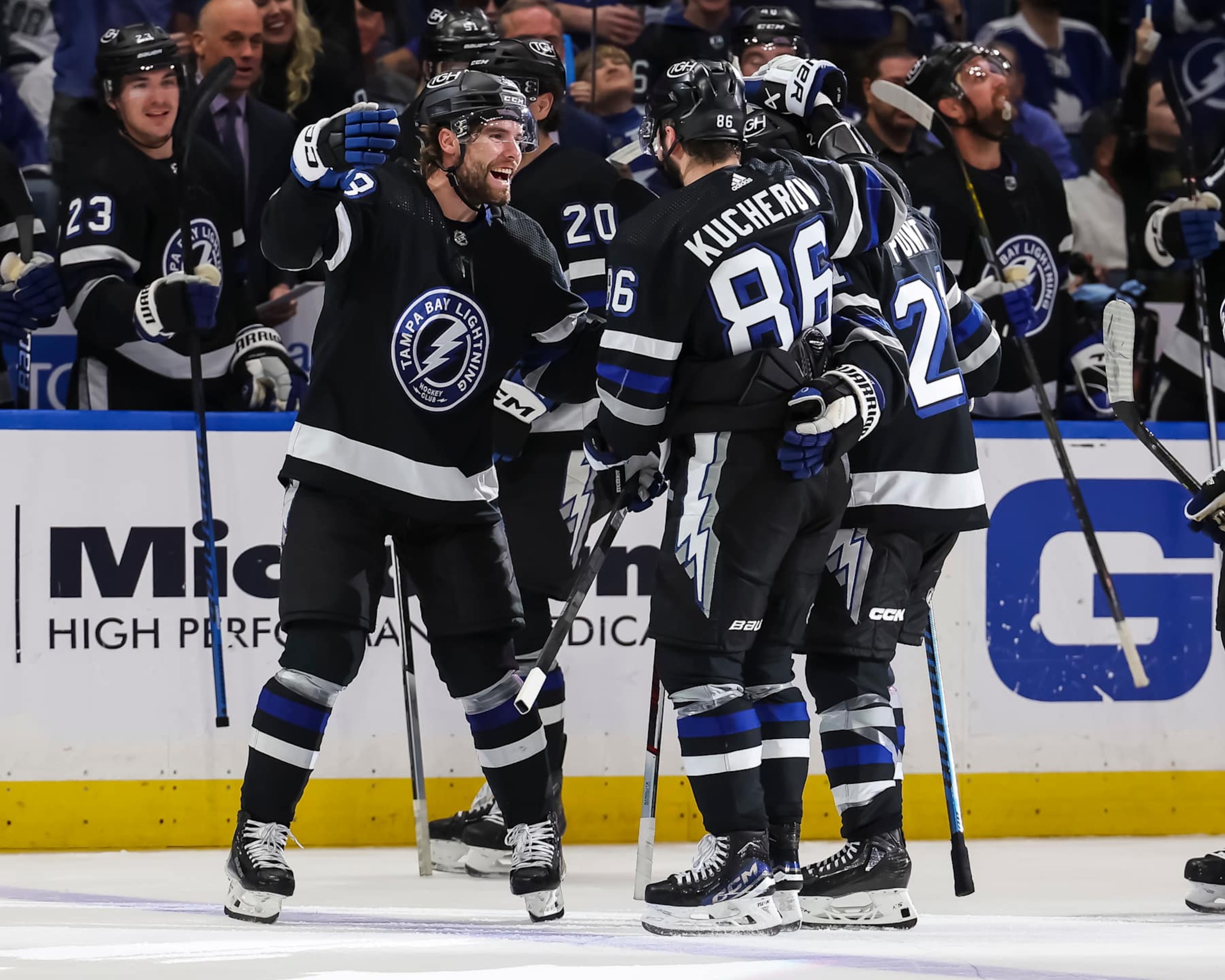 TAMPA, FL - APRIL 17: Nikita Kucherov #86 of the Tampa Bay Lightning celebrates his 100th assist on the season with Brandon Hagel #38 and Brayden Point #21 against the Toronto Maple Leafs during the second period at the Amalie Arena on April 17, 2024 in Tampa, Florida. (Photo by Mark LoMoglio/NHLI via Getty Images) TAMPA, FL - APRIL 17: Nikita Kucherov #86 of the Tampa Bay Lightning celebrates his 100th assist on the season with Brandon Hagel #38 and Brayden Point #21 against the Toronto Maple Leafs during the second period at the Amalie Arena on April 17, 2024 in Tampa, Florida. (Photo by Mark LoMoglio/NHLI via Getty Images)