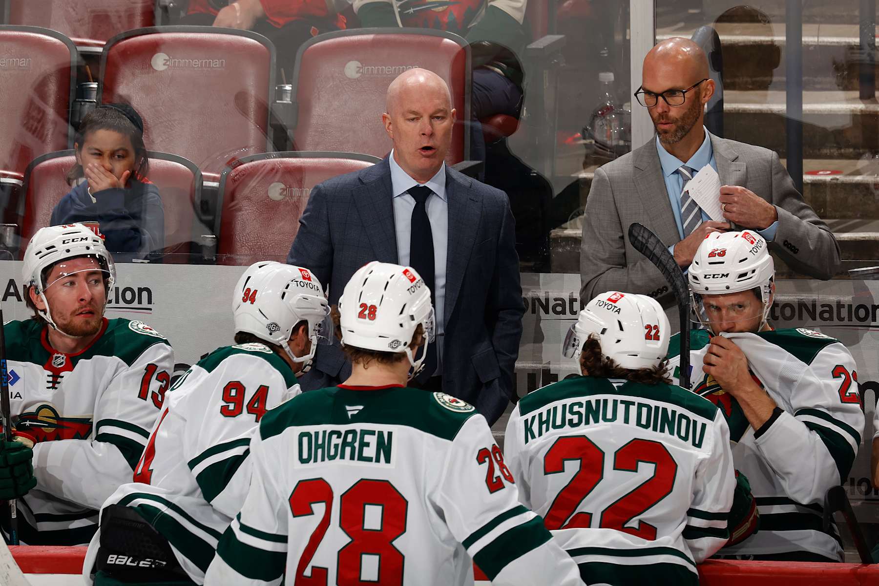 SUNRISE, FL - OCTOBER 22: Head coach John Hynes talks to Jakub Lauko #94, Liam Ohgren #28, and Marat Khusnutdinov #22 of the Minnesota Wild during a break in action against the Florida Panthers in the third period at the Amerant Bank Arena on October 22, 2024 in Sunrise, Florida. (Photo by Joel Auerbach/Getty Images)