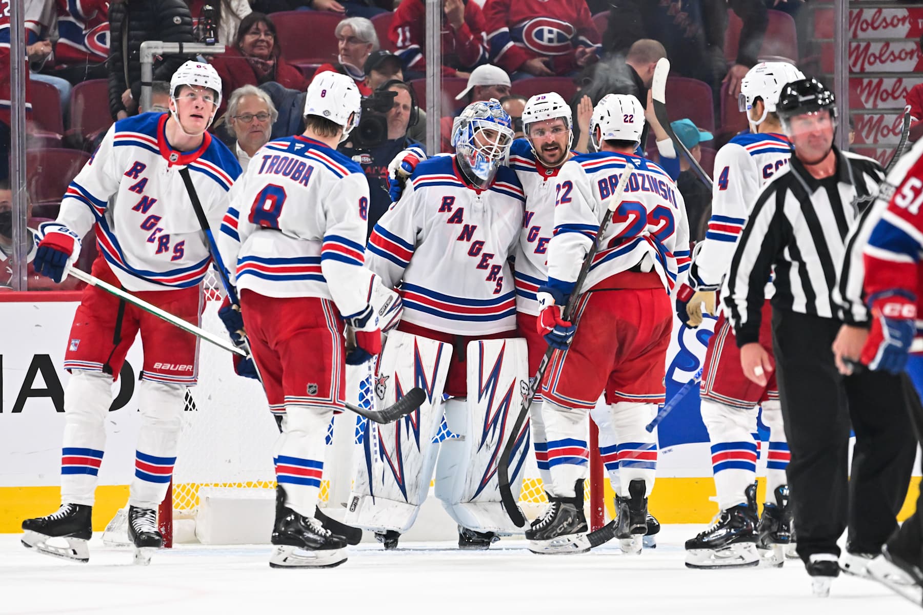 MONTREAL, CANADA - OCTOBER 22:  Goaltender Igor Shesterkin #31, Sam Carrick #39, Jacob Trouba #8 and Jonny Brodzinski #22 of the New York Rangers celebrate a victory against the Montreal Canadiens at the Bell Centre on October 22, 2024 in Montreal, Quebec, Canada.  The New York Rangers defeated the Montreal Canadiens 7-2.  (Photo by Minas Panagiotakis/Getty Images)