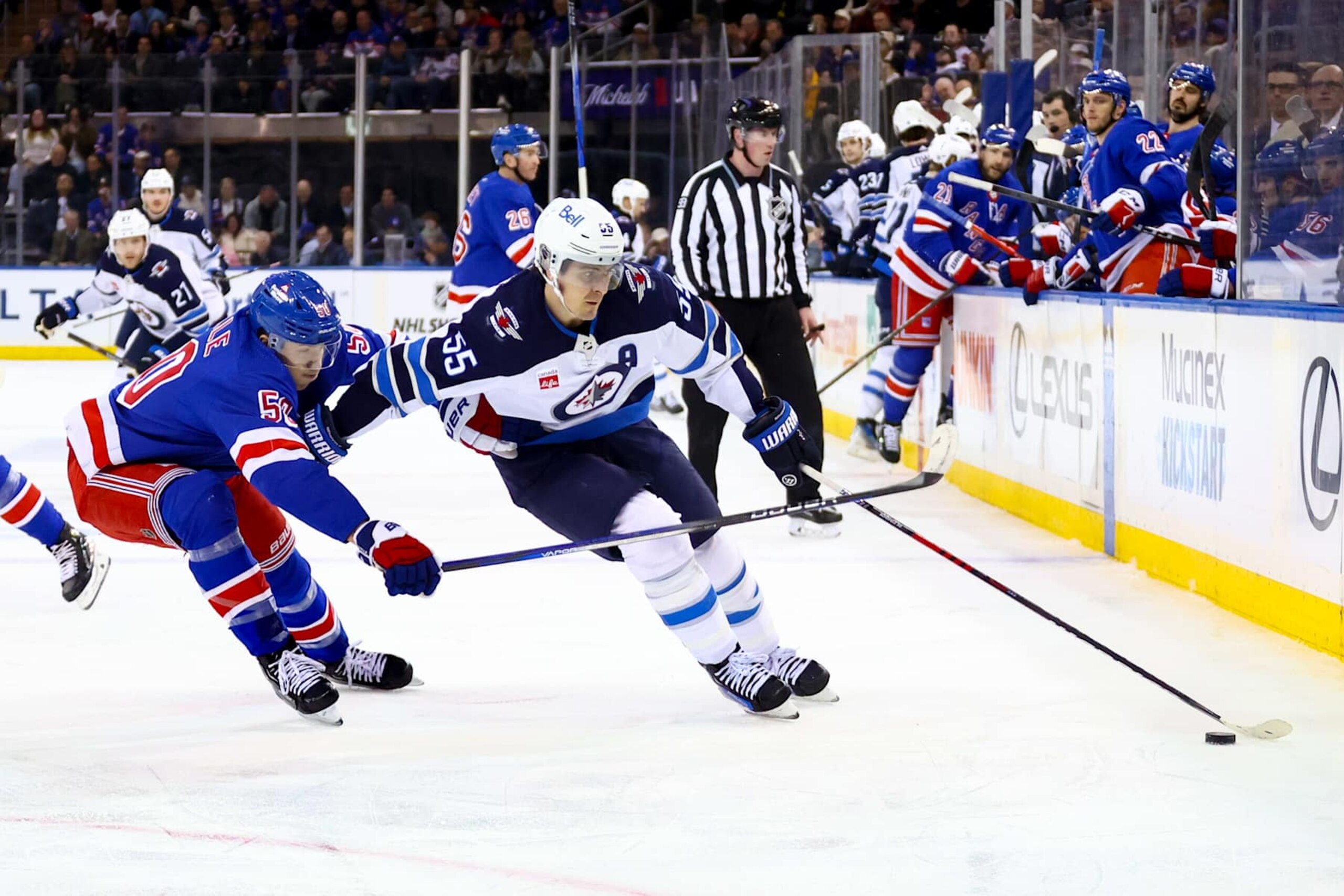 NEW YORK, NY - MARCH 19: Winnipeg Jets Center Mark Scheifele (55) skates against New York Rangers Left Wing Will Cuylle (50) during the first period of the National Hockey League game between the Winnipeg Jets and the New York Rangers on March 19, 2024 at Madison Square Garden in New York, NY. (Photo by Joshua Sarner/Icon Sportswire via Getty Images) NEW YORK, NY - MARCH 19: Winnipeg Jets Center Mark Scheifele (55) skates against New York Rangers Left Wing Will Cuylle (50) during the first period of the National Hockey League game between the Winnipeg Jets and the New York Rangers on March 19, 2024 at Madison Square Garden in New York, NY. (Photo by Joshua Sarner/Icon Sportswire via Getty Images)