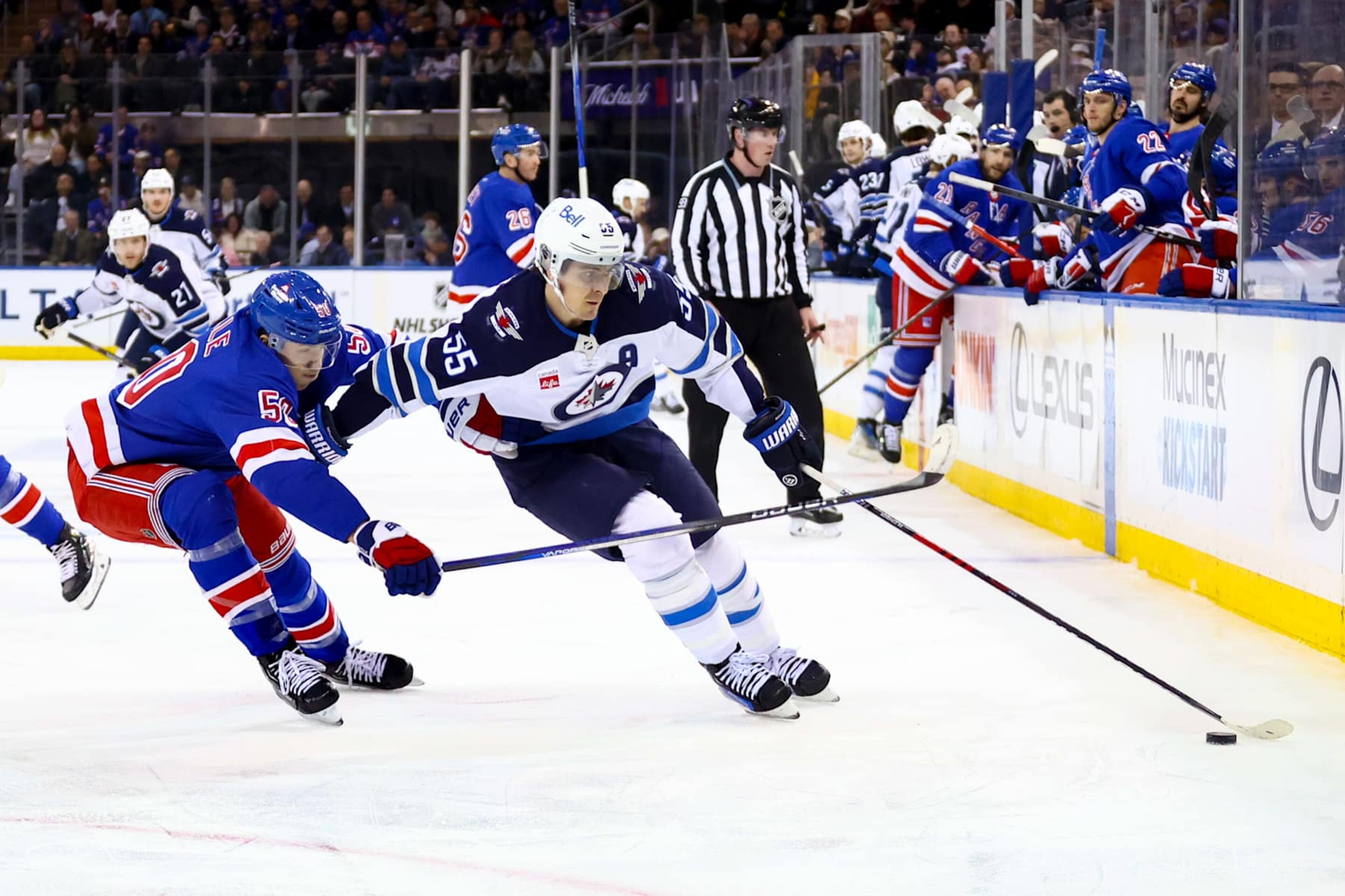 NEW YORK, NY - MARCH 19: Winnipeg Jets Center Mark Scheifele (55) skates against New York Rangers Left Wing Will Cuylle (50) during the first period of the National Hockey League game between the Winnipeg Jets and the New York Rangers on March 19, 2024 at Madison Square Garden in New York, NY. (Photo by Joshua Sarner/Icon Sportswire via Getty Images) NEW YORK, NY - MARCH 19: Winnipeg Jets Center Mark Scheifele (55) skates against New York Rangers Left Wing Will Cuylle (50) during the first period of the National Hockey League game between the Winnipeg Jets and the New York Rangers on March 19, 2024 at Madison Square Garden in New York, NY. (Photo by Joshua Sarner/Icon Sportswire via Getty Images)
