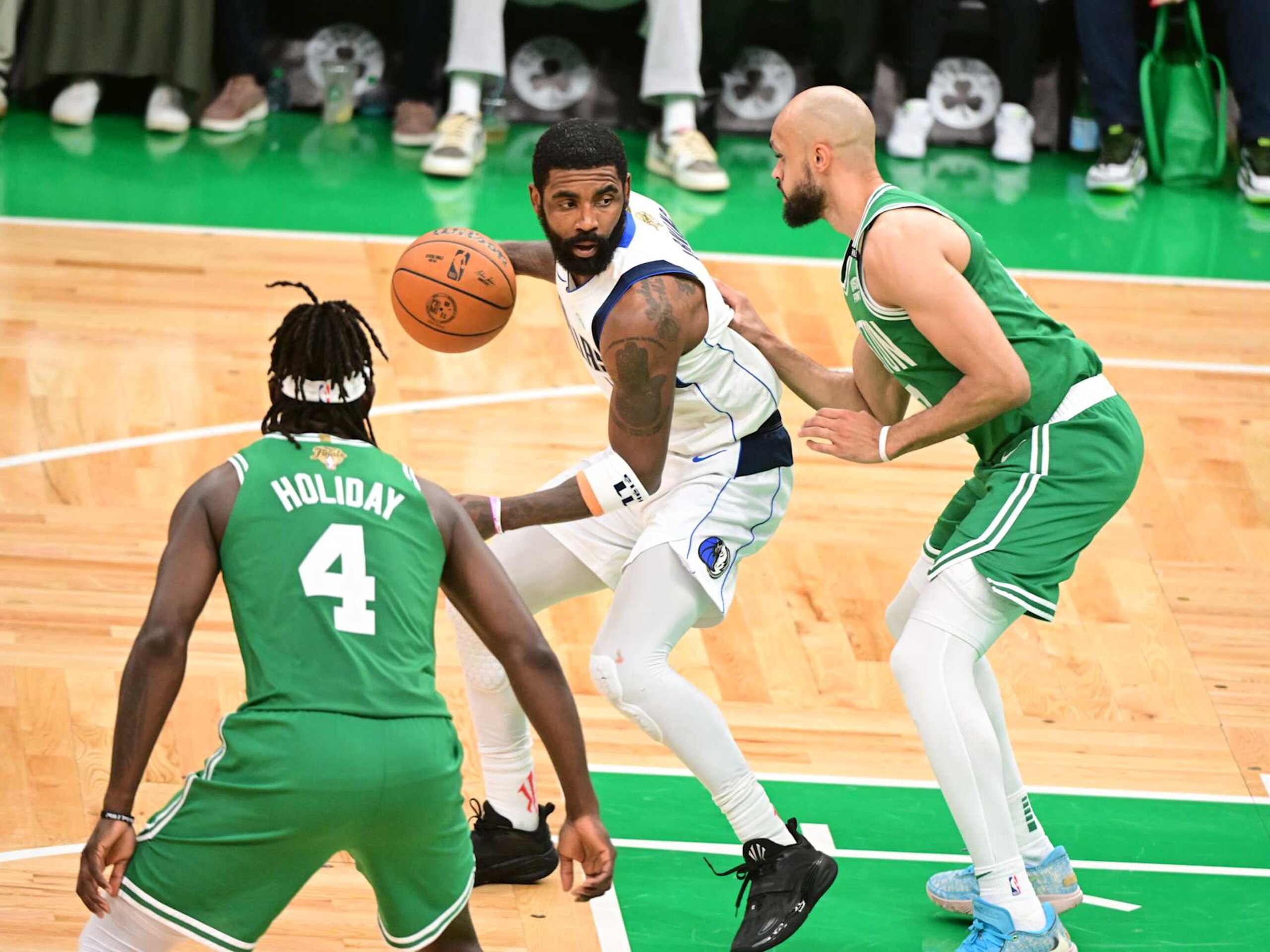 Jrue Holiday, Kyrie Irving and Derrick White