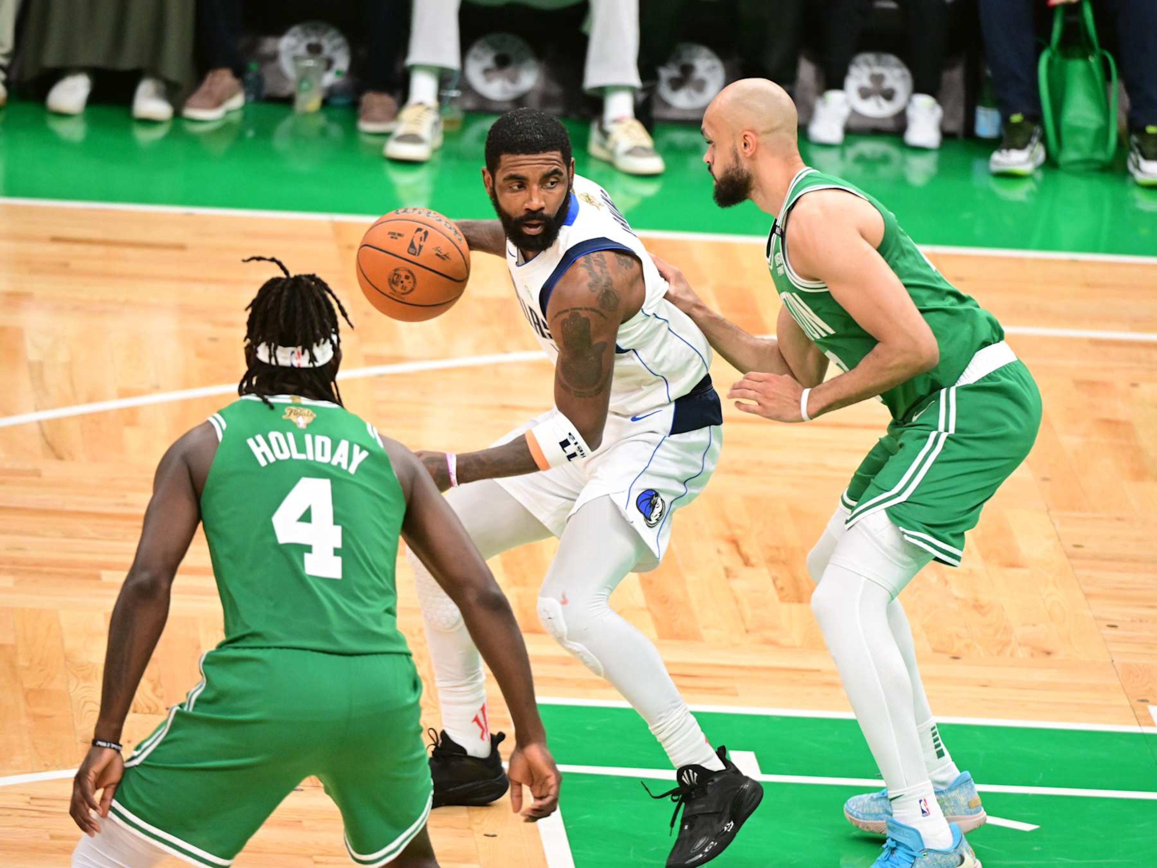 Jrue Holiday, Kyrie Irving and Derrick White