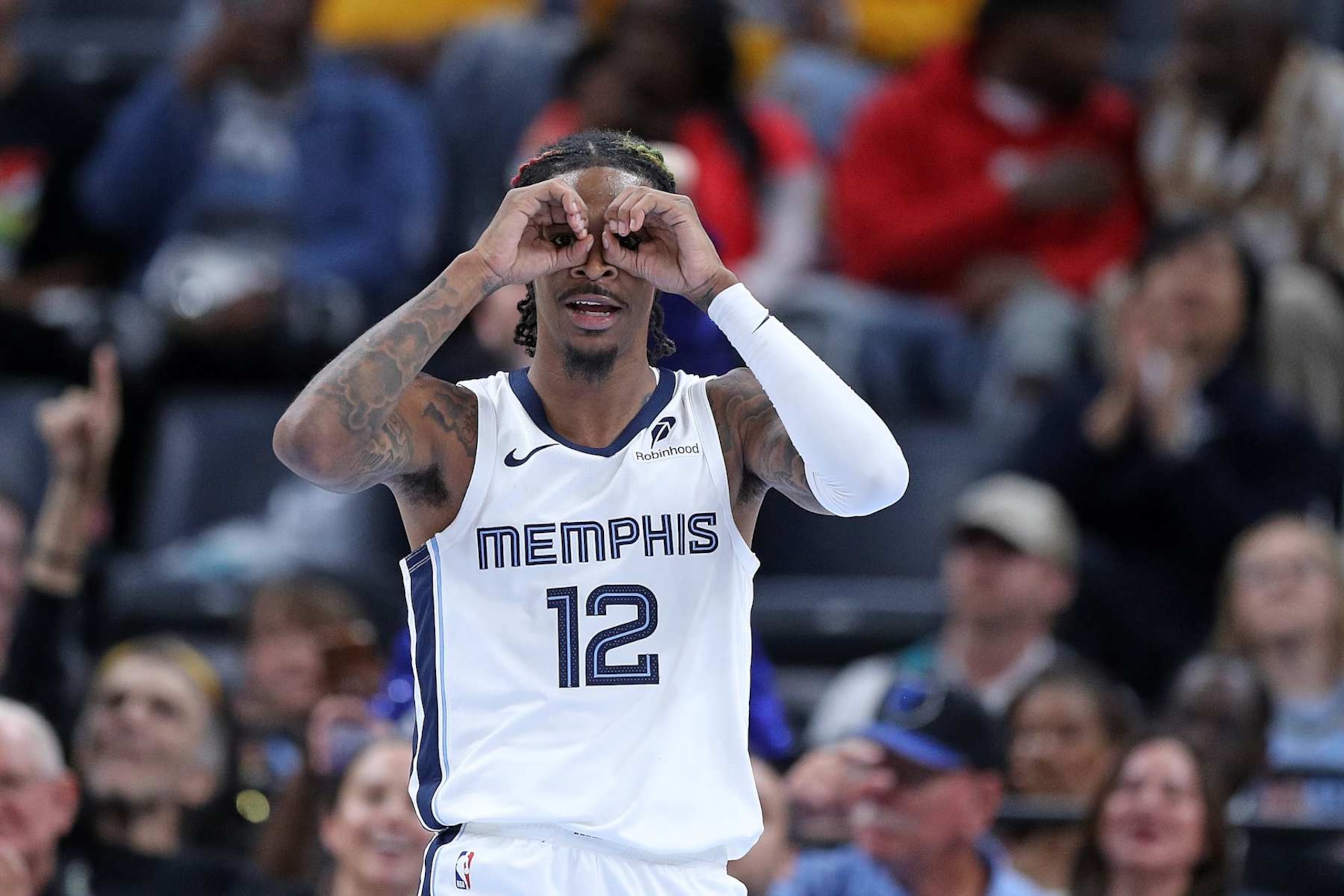 MEMPHIS, TENNESSEE - OCTOBER 18: Ja Morant #12 of the Memphis Grizzlies looks on during the game against the Miami Heat at FedExForum on October 18, 2024 in Memphis, Tennessee. NOTE TO USER: User expressly acknowledges and agrees that, by downloading and or using this photograph, User is consenting to the terms and conditions of the Getty Images License Agreement. (Photo by Justin Ford/Getty Images)