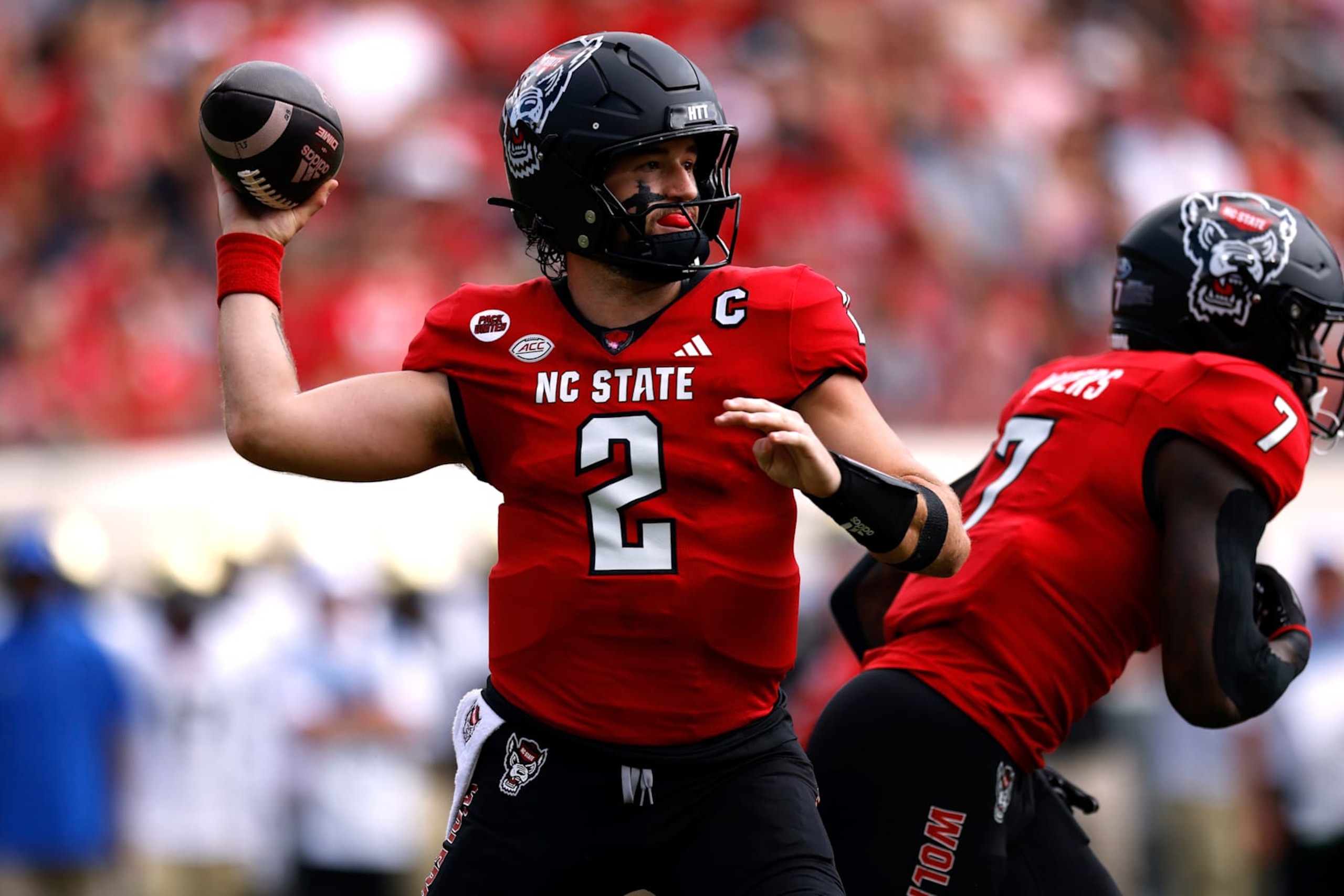 RALEIGH, NORTH CAROLINA - OCTOBER 5: Grayson McCall #2 of the NC State Wolfpack drops back to pass against the Wake Forest Demon Deacons during the first half of the game at Carter-Finley Stadium on October 5, 2024 in Raleigh, North Carolina. (Photo by Lance King/Getty Images) RALEIGH, NORTH CAROLINA - OCTOBER 5: Grayson McCall #2 of the NC State Wolfpack drops back to pass against the Wake Forest Demon Deacons during the first half of the game at Carter-Finley Stadium on October 5, 2024 in Raleigh, North Carolina. (Photo by Lance King/Getty Images)